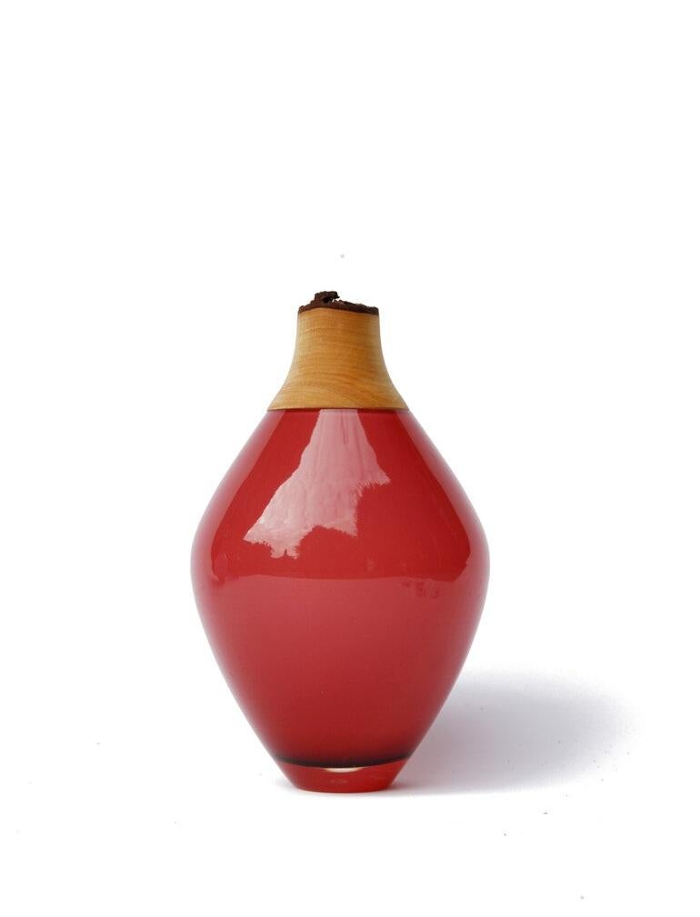 Opal rose Matisse stacking vessel III, Pia Wüstenberg
Dimensions: D 11 x H 21
Materials: glass, wood
Available in other colors.

The Matisse Stacking Vessels are treasures, small splashes of curvy glass with a wooden crown. The collection was