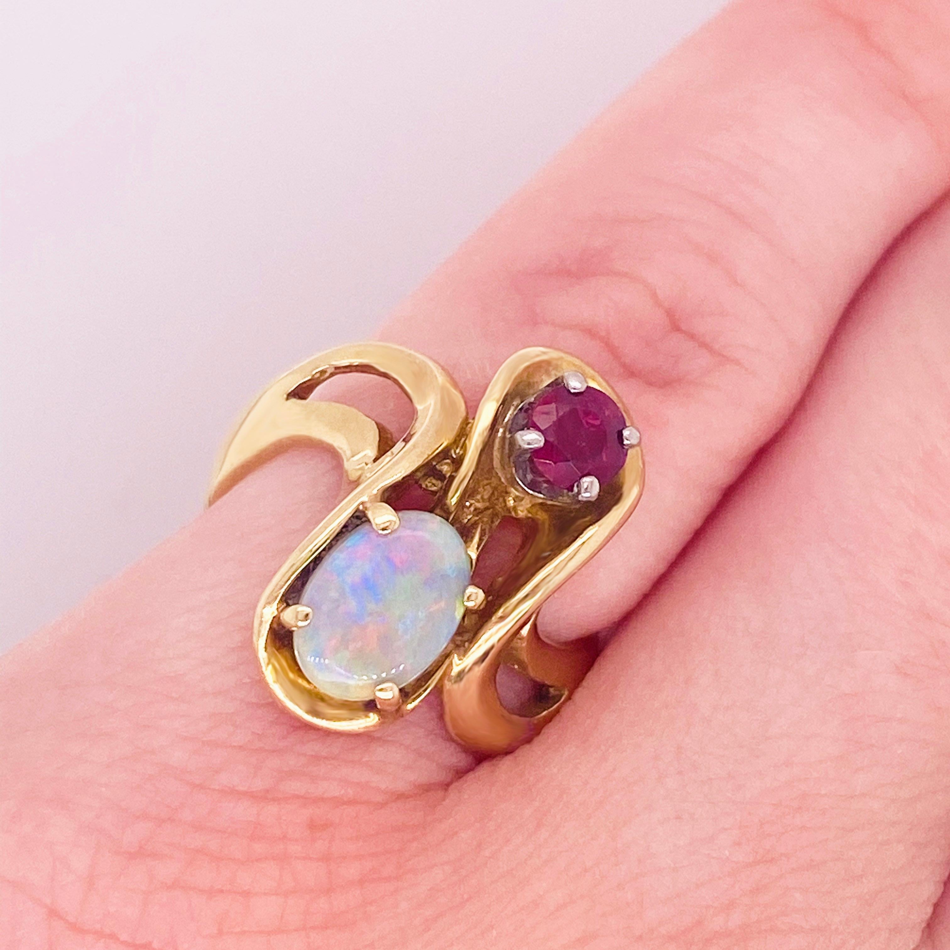 This elegant one of a kind freeform ring will make the perfect gift for your loved one or yourself! 
Opal is unique among gems, as it displays an array of very brilliant miniature rainbow iridescent effects. Opal is also the birthstone of October