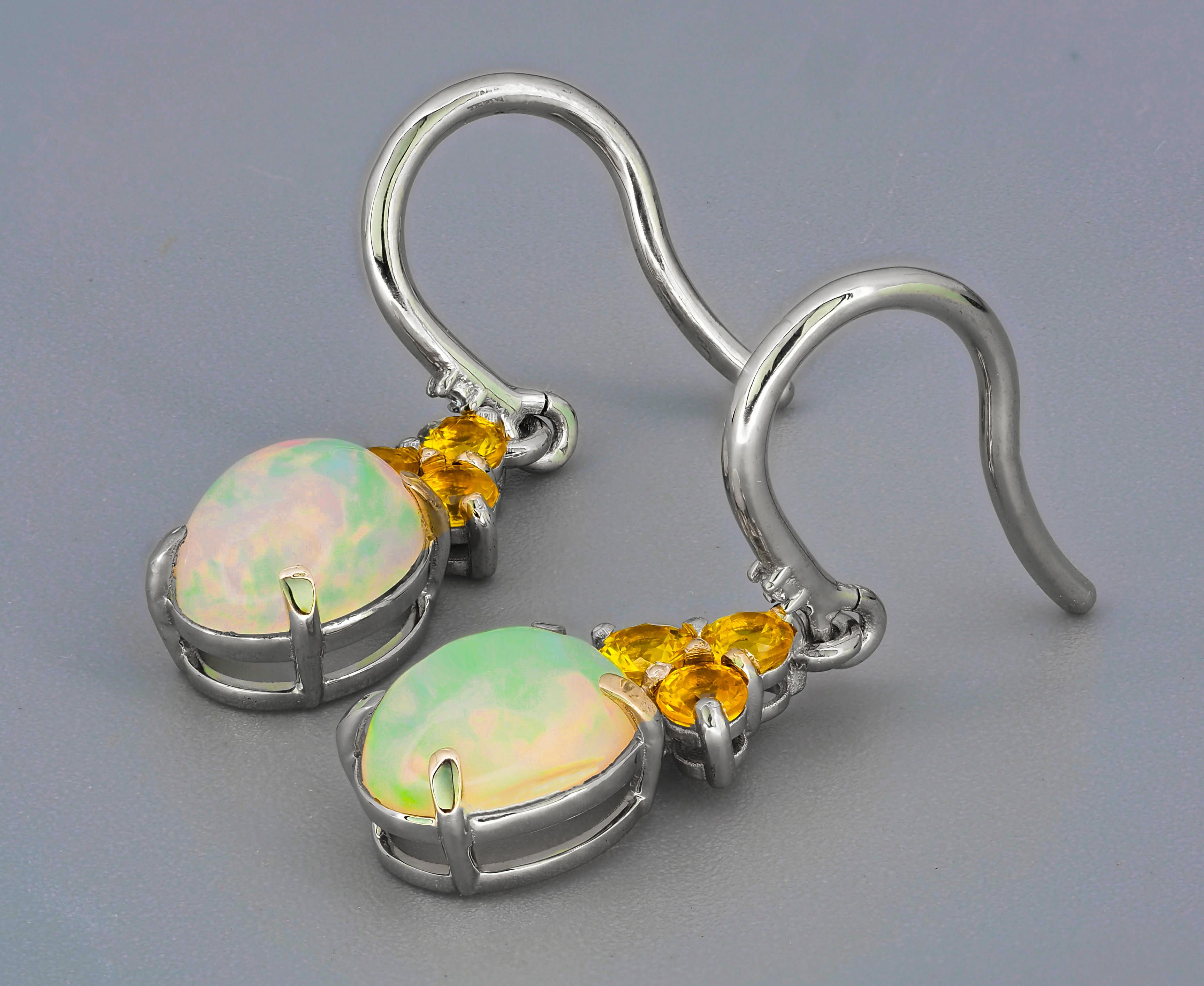 Oval Cut Opal, sapphire 14k gold earrings.  For Sale