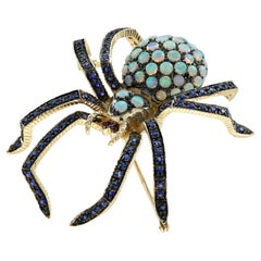 Spinnenbrosche aus 14 Karat Gelbgold mit Opal, Saphir und Rubin im Art-déco-Stil
