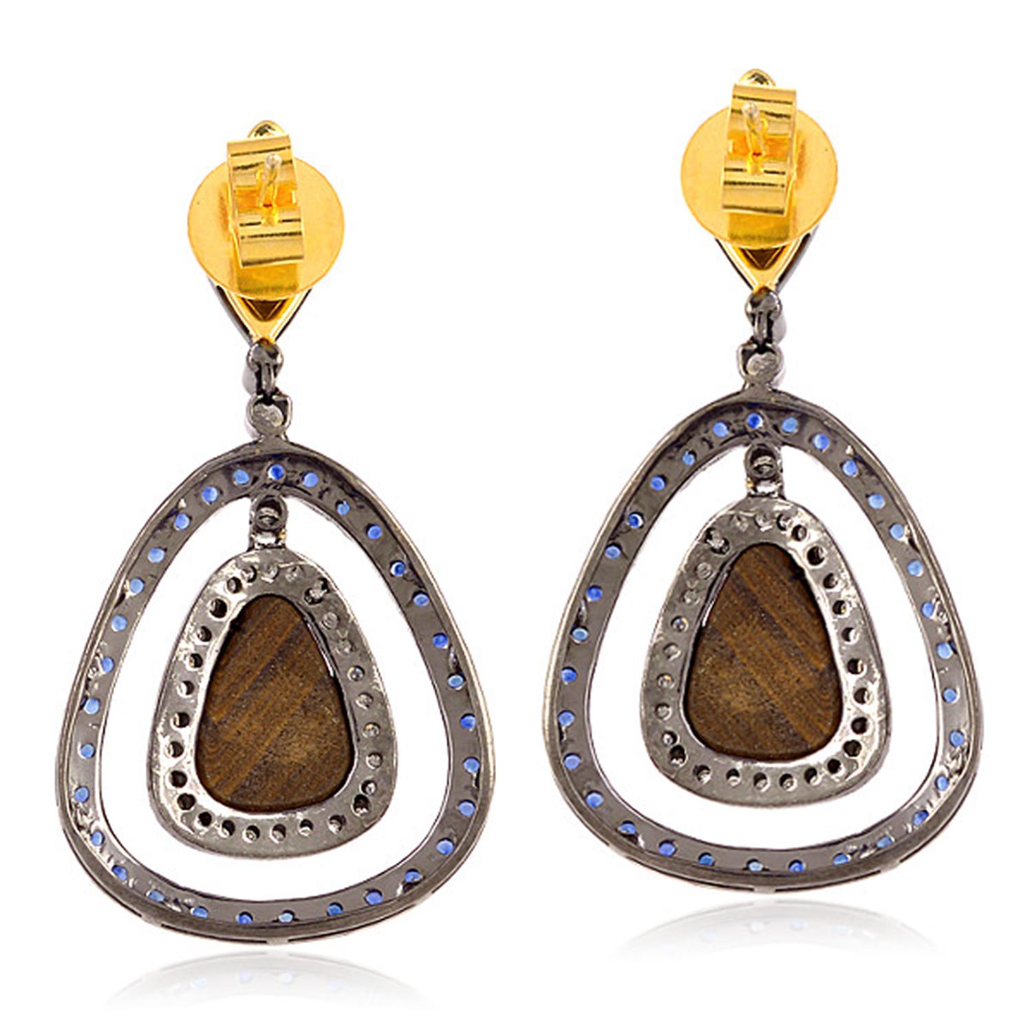 Cast from 18-karat gold & sterling silver, these beautiful drop earrings are set with 4.35 carats Opal doublets, 2.16 sapphire and .92 carats of glimmering diamonds. 

FOLLOW  MEGHNA JEWELS storefront to view the latest collection & exclusive