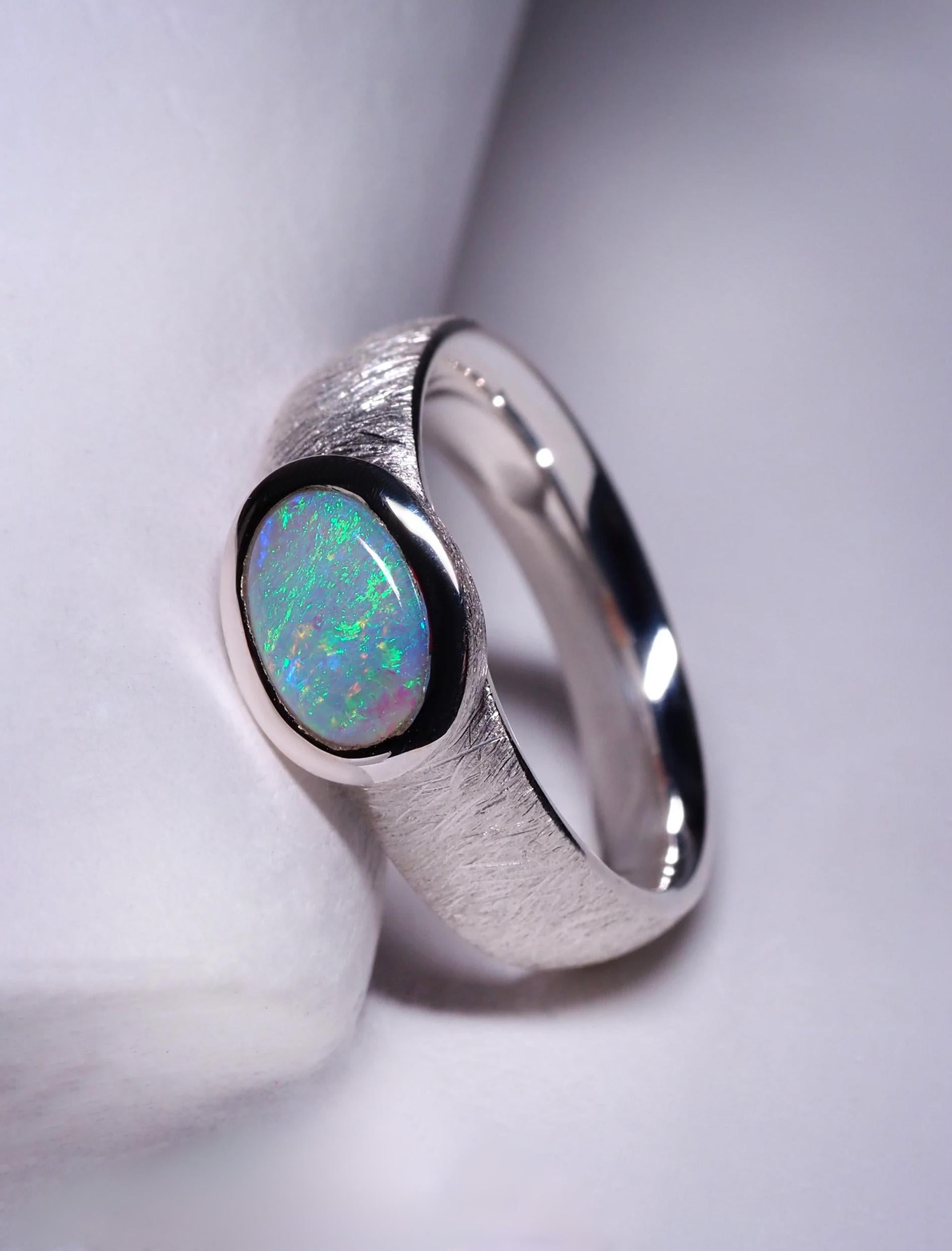 Matte finish silver ring with natural Opal 
gemstone origin - Australia
opal measurements - 0.24 x 0.35 in / 6 х 9 mm
opal weight - 1 carats
ring size - 6 3/4 US
ring weight - 5.11 grams