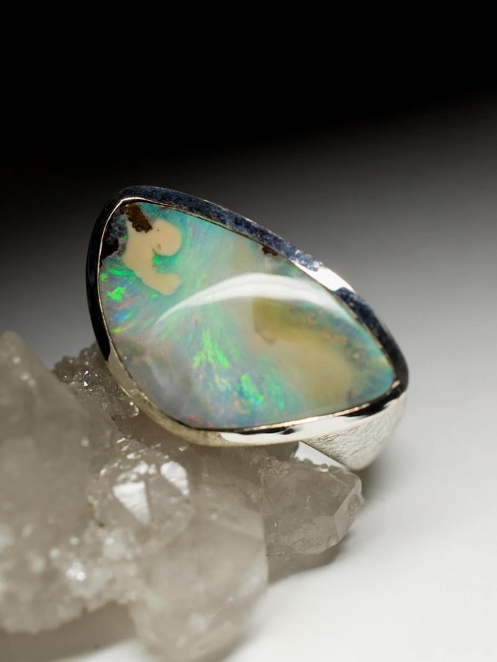 Men's matte finish silver ring with natural Boulder Opal
opal origin - Australia 
ring weight - 11.51 grams
ring size - 10 1/4 US / 62.5 EU 
opal measurements - 0.28 х 0.55 x 0.94 in / 7 x 14 x 24 mm
opal weight - 14.90 carats


We ship our jewelry