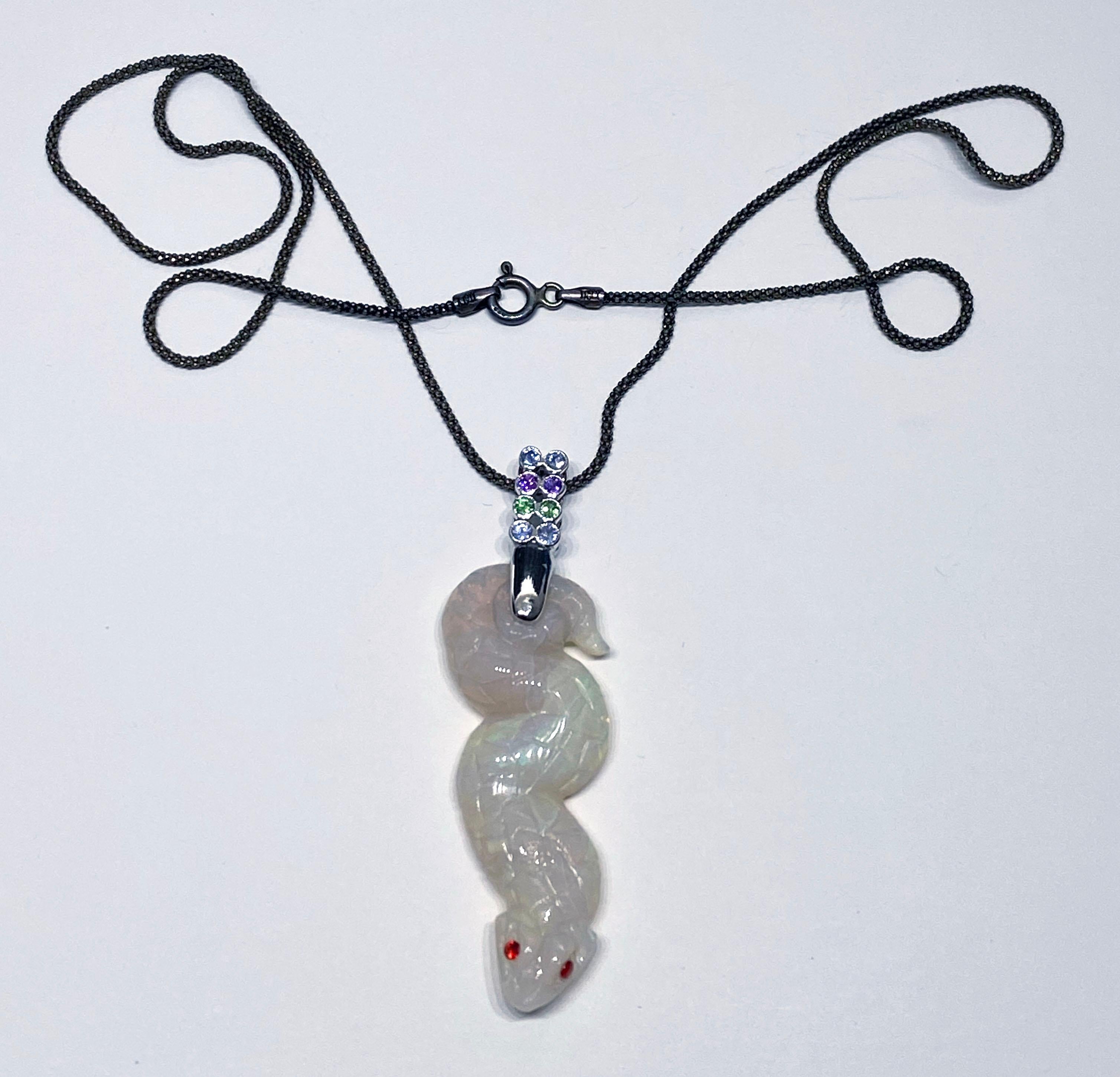 Contemporary Opal Snake Pendant in 18kt White Gold set with multi colored Sapphires For Sale