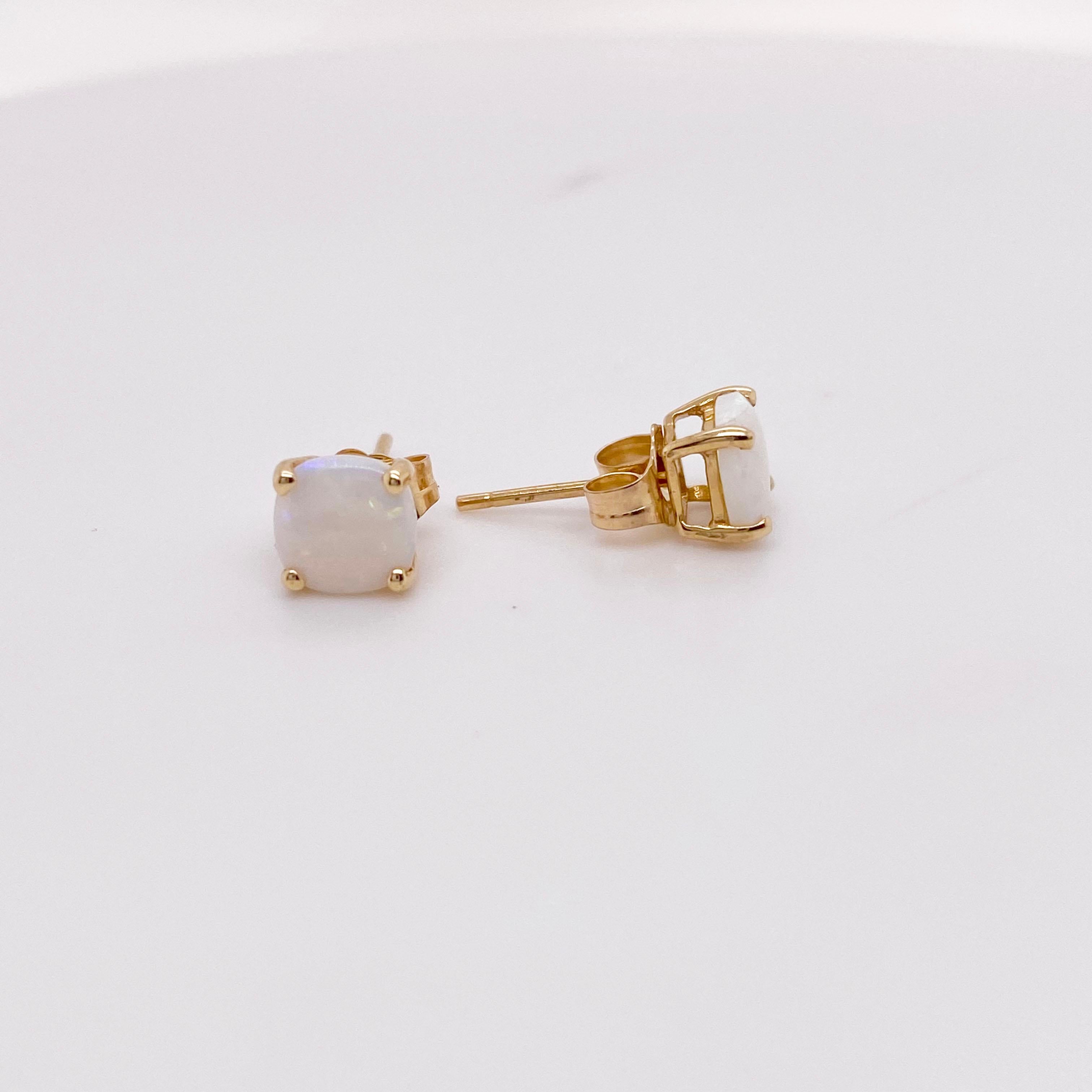 The details for these gorgeous earrings are listed below:
Metal Quality: 14kt Yellow Gold 
Earring Type: Stud 
Gemstone: Opal
Gemstone Weight: 0.57 ct 
Gemstone Color: Opal
Measurements: 6mm X 6mm 
Post Type: Stud
Total Carat Weight: 0.57 ct 