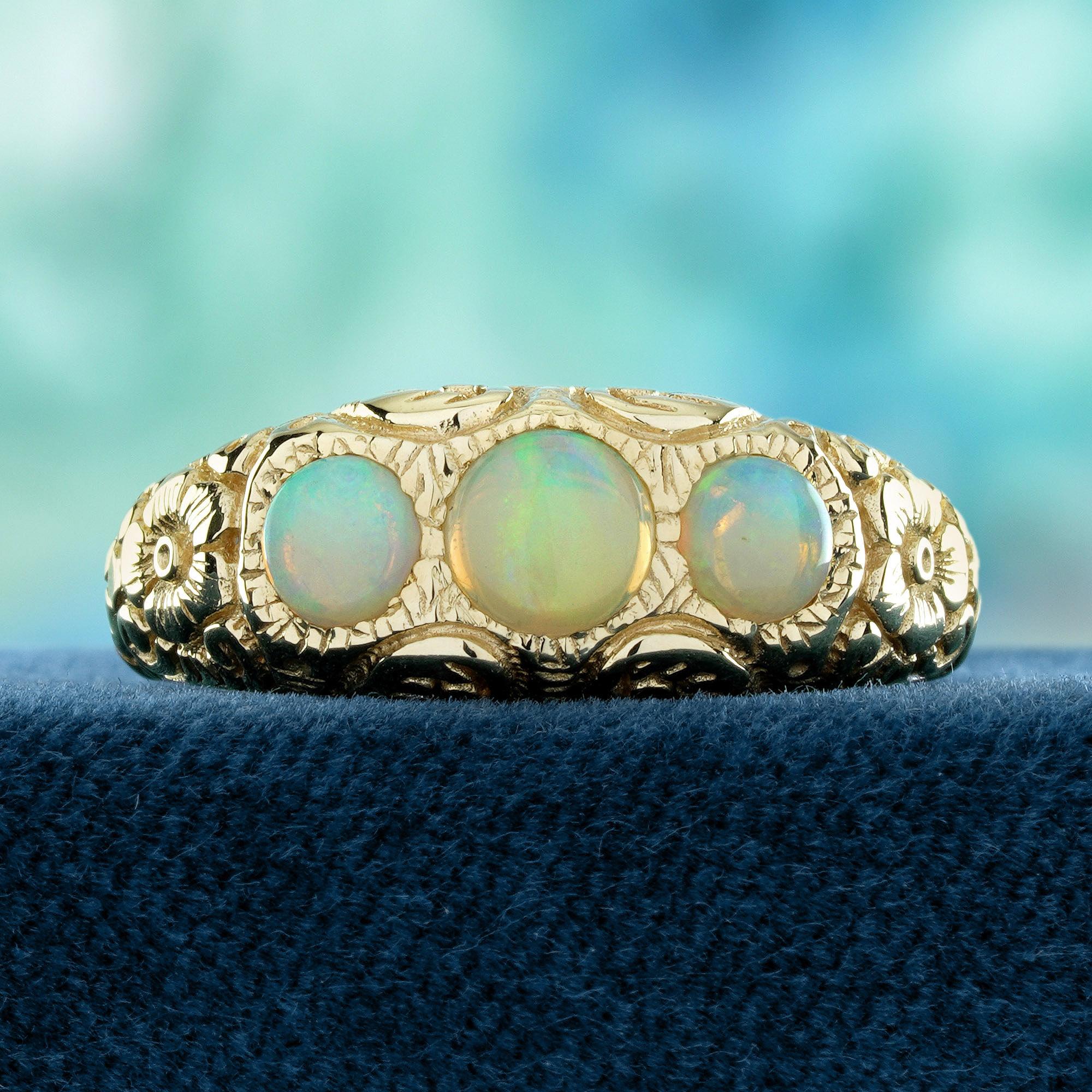 A  natural opals, each stone radiating an ethereal play of color. The opals are set in an elegant arrangement, creating a stunning focal point. The band is beautifully carved with intricate floral patterns, adding a delicate touch of nature-inspired