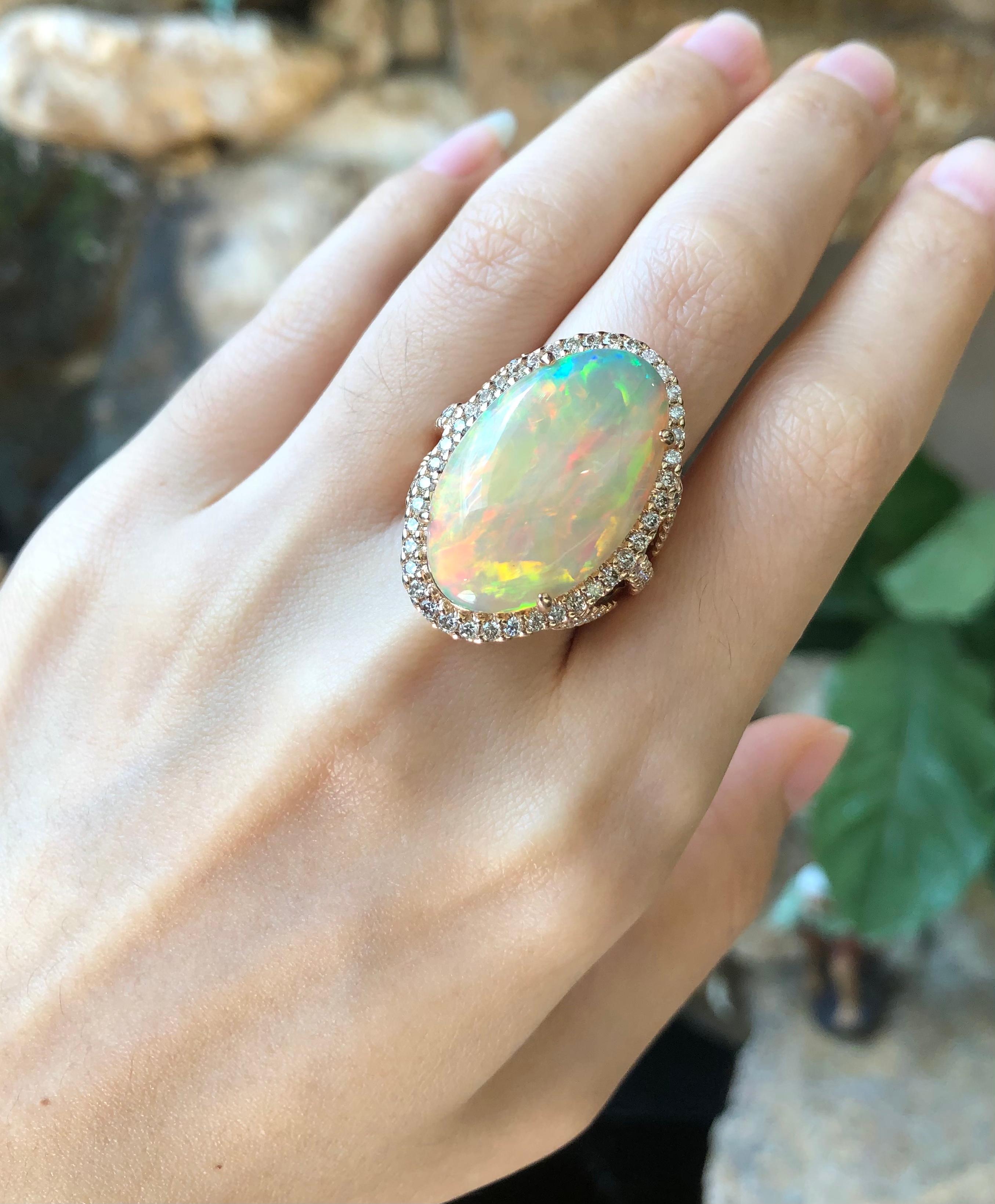 Opal 10.68 carats with Brown Diamond 1.46 carats Ring set in 18 Karat Rose Gold Settings

Width:  2.2 cm 
Length: 3.0 cm
Ring Size: 54
Total Weight: 17.59 grams

