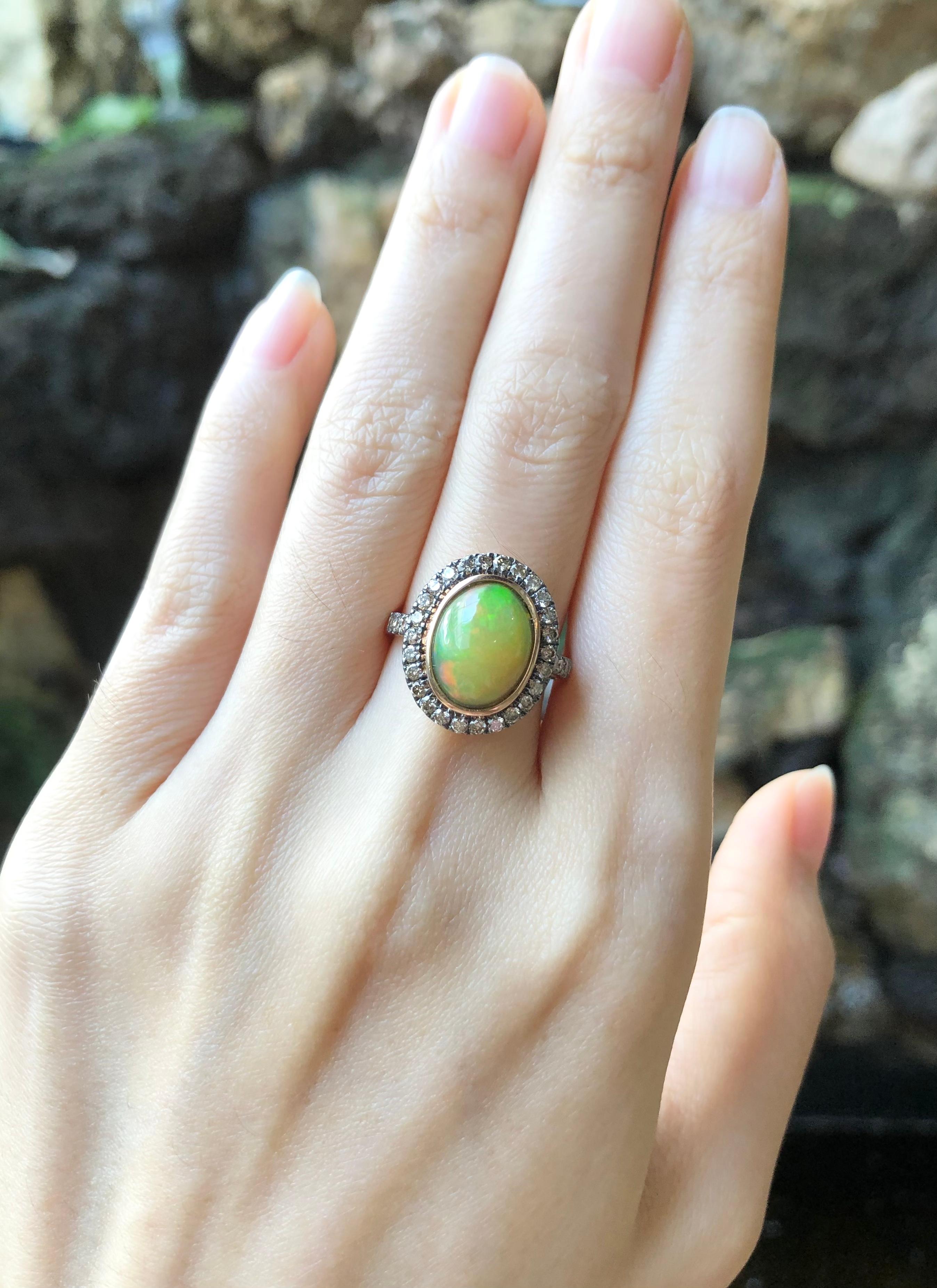 Opal 2.58 carats with Brown Diamond 0.63 carat Ring set in 18 Karat Rose Gold Settings

Width:  1.2 cm 
Length: 1.6 cm
Ring Size: 52
Total Weight: 6.12 grams


