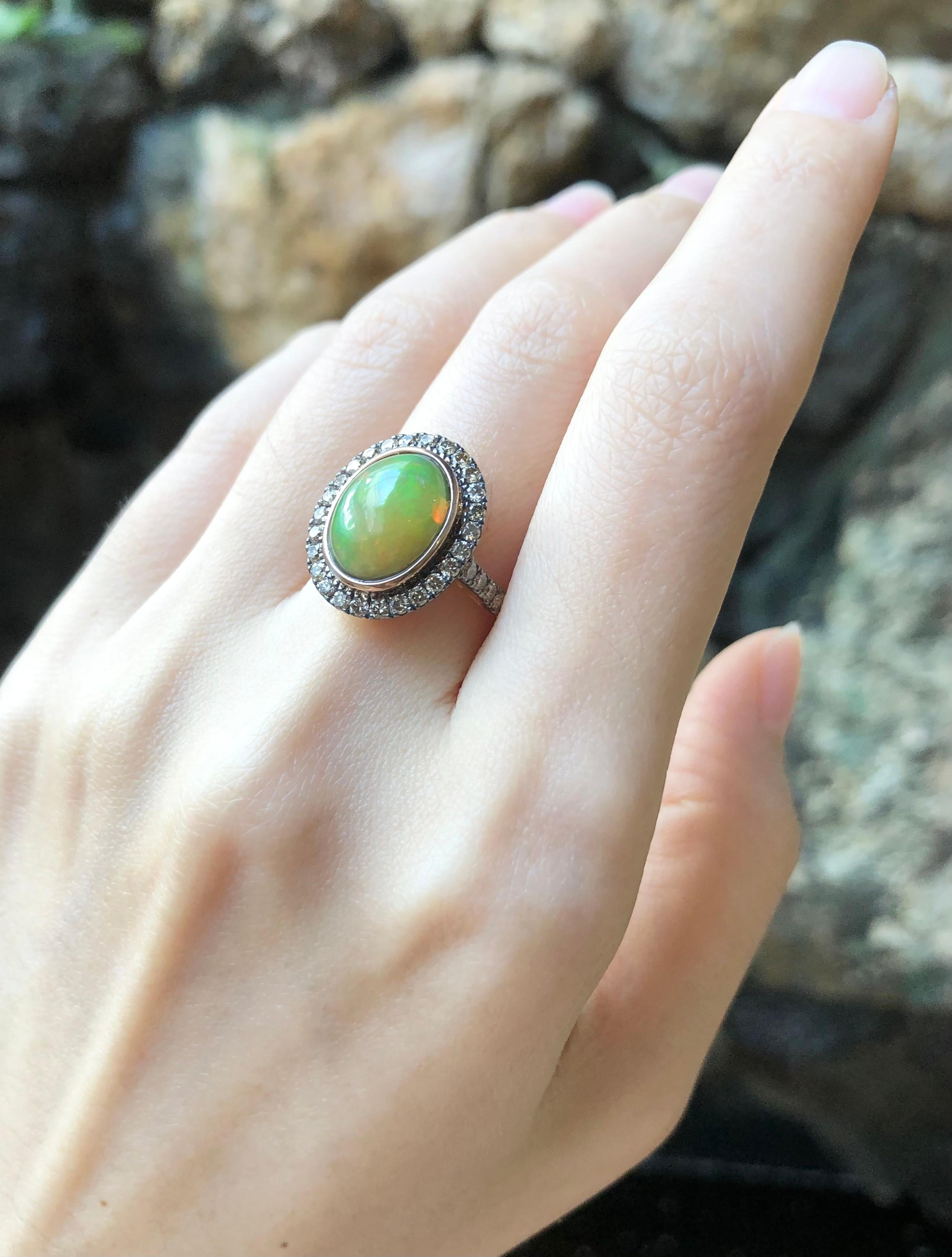 Contemporary Opal with Brown Diamond Ring Set in 18 Karat Rose Gold Settings For Sale