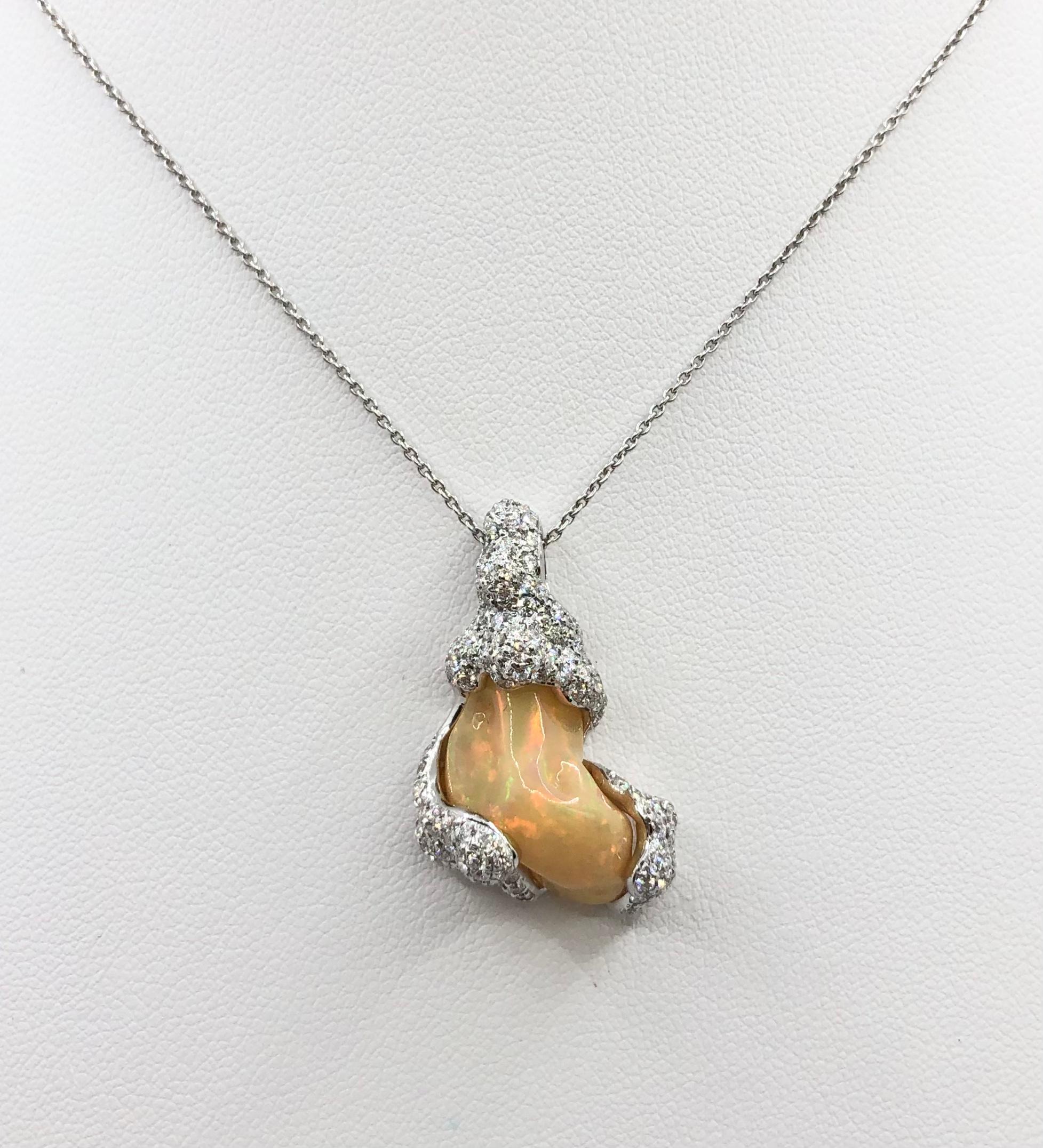 Opal 6.79 carats with Diamond 1.24 carats Pendant set in 18 Karat White Gold Settings
(chain not included)

Width: 1.9 cm 
Length: 3.0 cm
Total Weight: 7.0 grams

