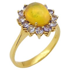 Opal with Tanzanite Ring Set in 18 Karat Gold Settings