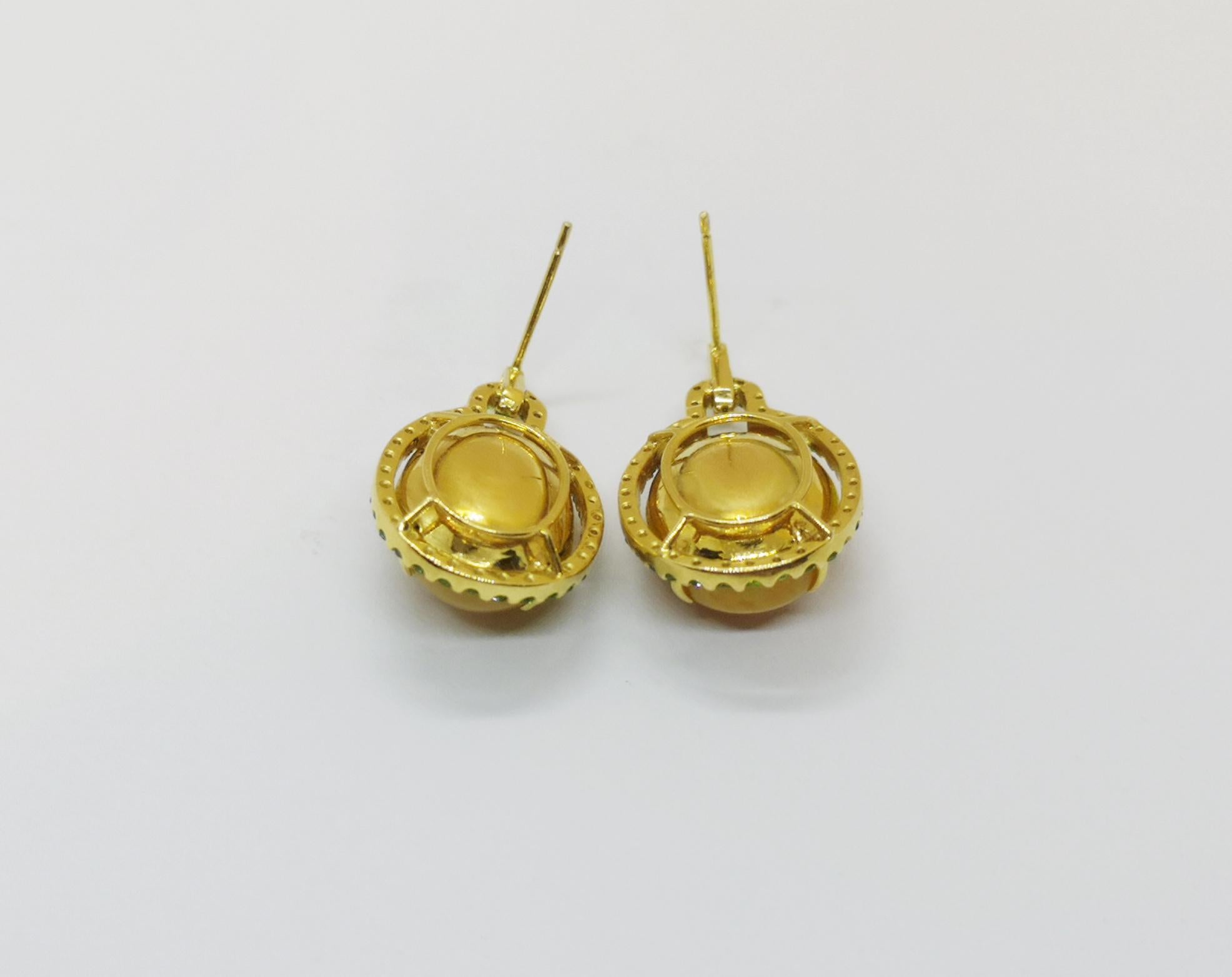 Opal 19.74 carats with Tsavorite 1.07 carats Earrings set in 18 Karat Gold Settings

Width: 1.7 cm
Length: 3.5 cm 

