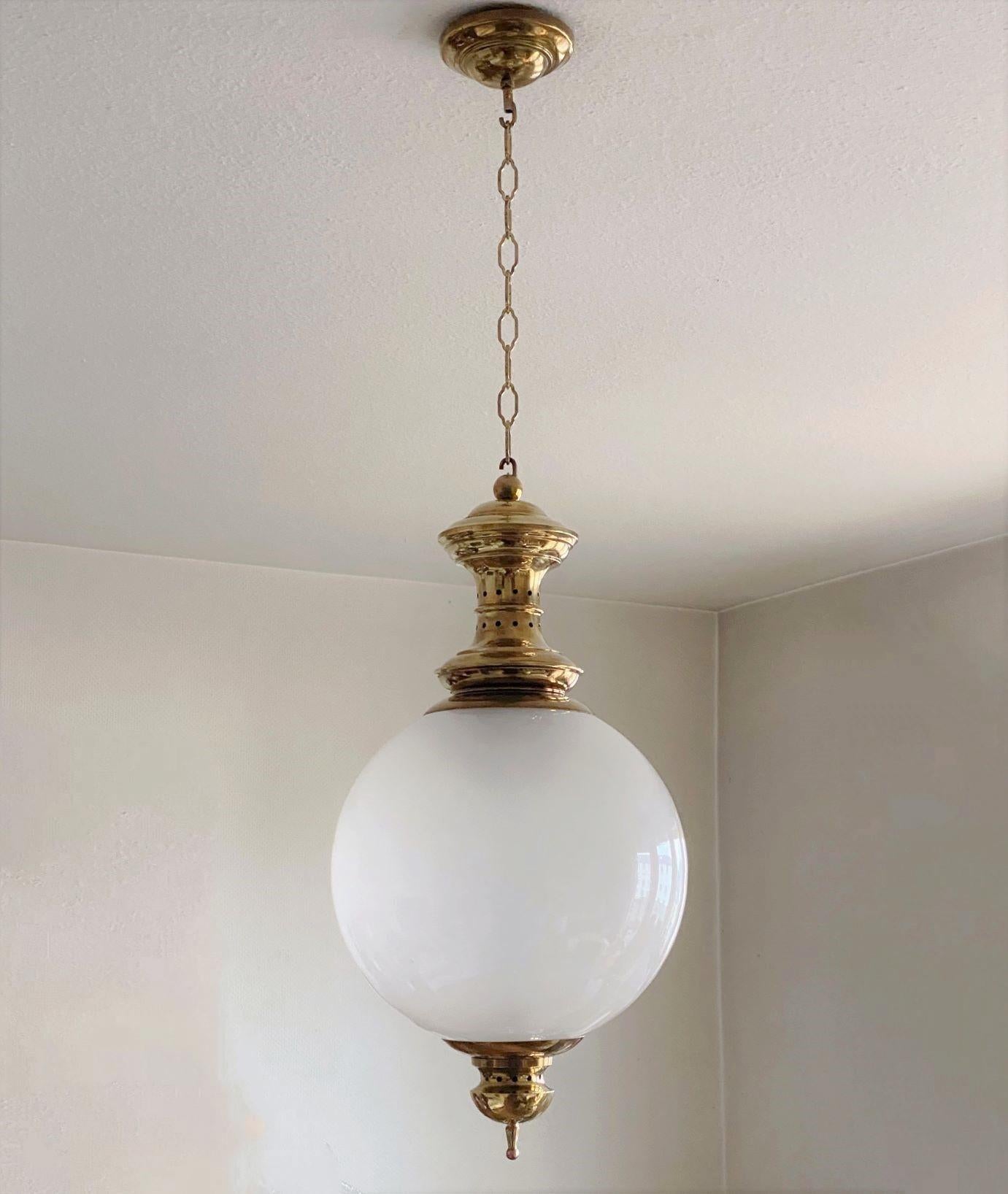 A refined three-light pendant by the famous Italian artist and designer Luigi Caccia Dominioni, Italy, 1950. Large-sized lamp of hand blown opalescent glass and brass. The Model LS1 was designed and manufactured exclusively for the renowned Azucena