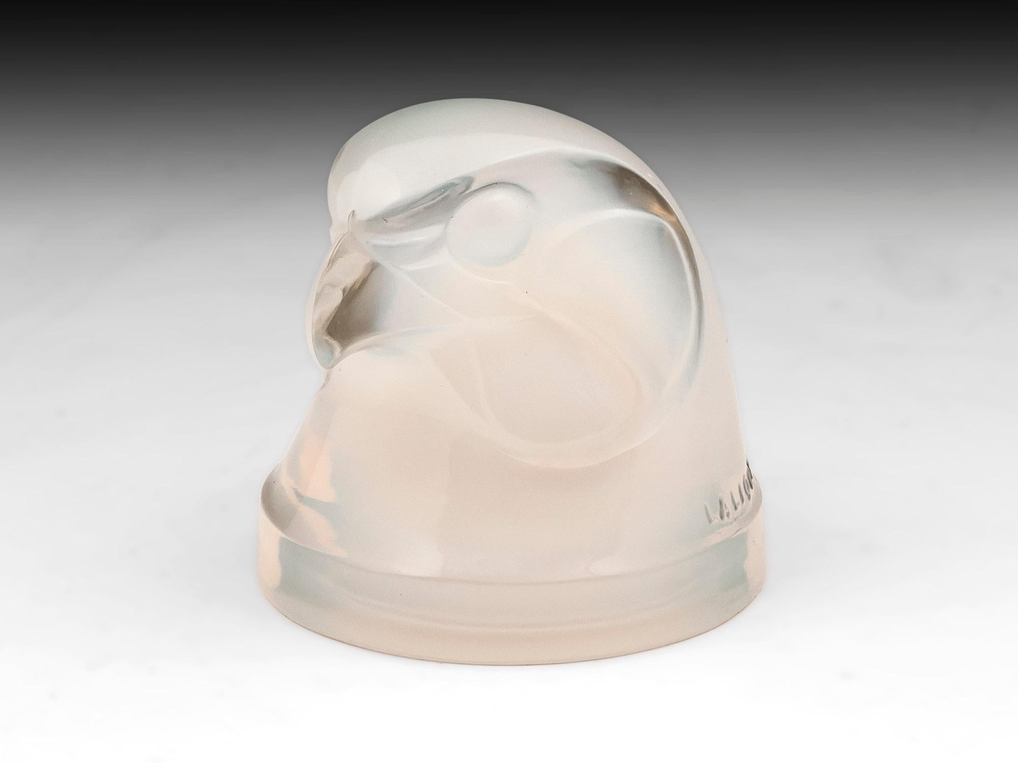 Rene Lalique Tete d’Epervier (hawk’s head) with a wonderful opalescent color.Model number #1139.
Faintly signed with moulded relief “Lalique France” with double tailed “Q” with FRANCE in block capitals on the lower back of the neck.

These