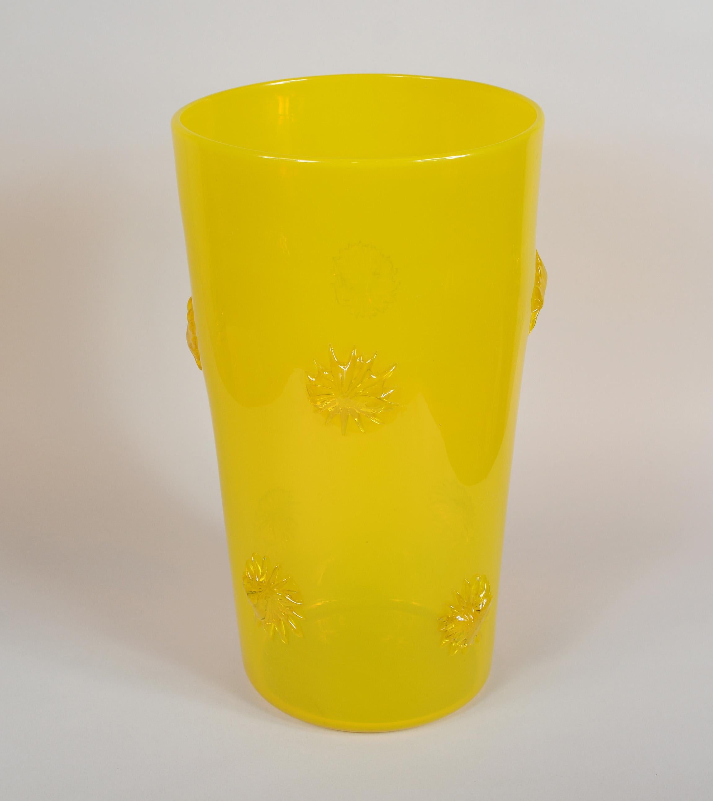 Opalescent yellow glass vase from the Empoli region of Italy. This has applied starbursts around the vase.