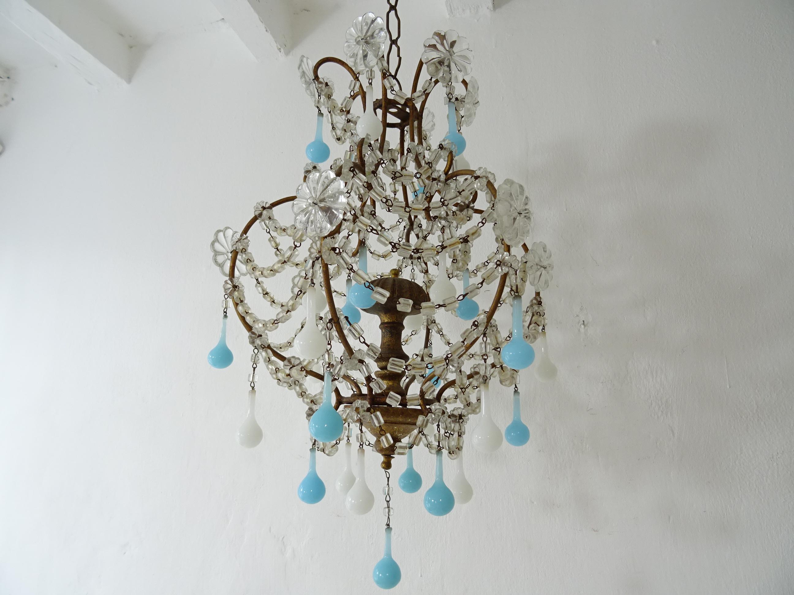 Housing one light on top. Will be re-wired with certified UL US sockets for the United States and appropriate sockets for other countries and ready to hang, . Gilt metal with glass florets and macaroni beading swags. 31 blue and white opaline Murano