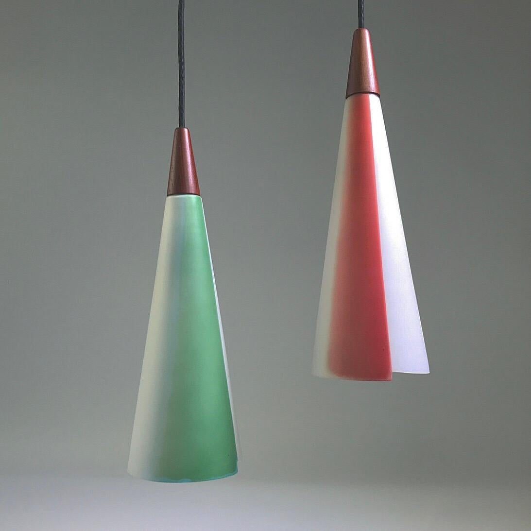 Rare and stunning beauty is the headline of this cone shaped opaline glass set. 

All original set of green and red ceiling lights. Top is made of solid teak and the thick opaline glass has beautiful and unusual shape to the edge. 

Great