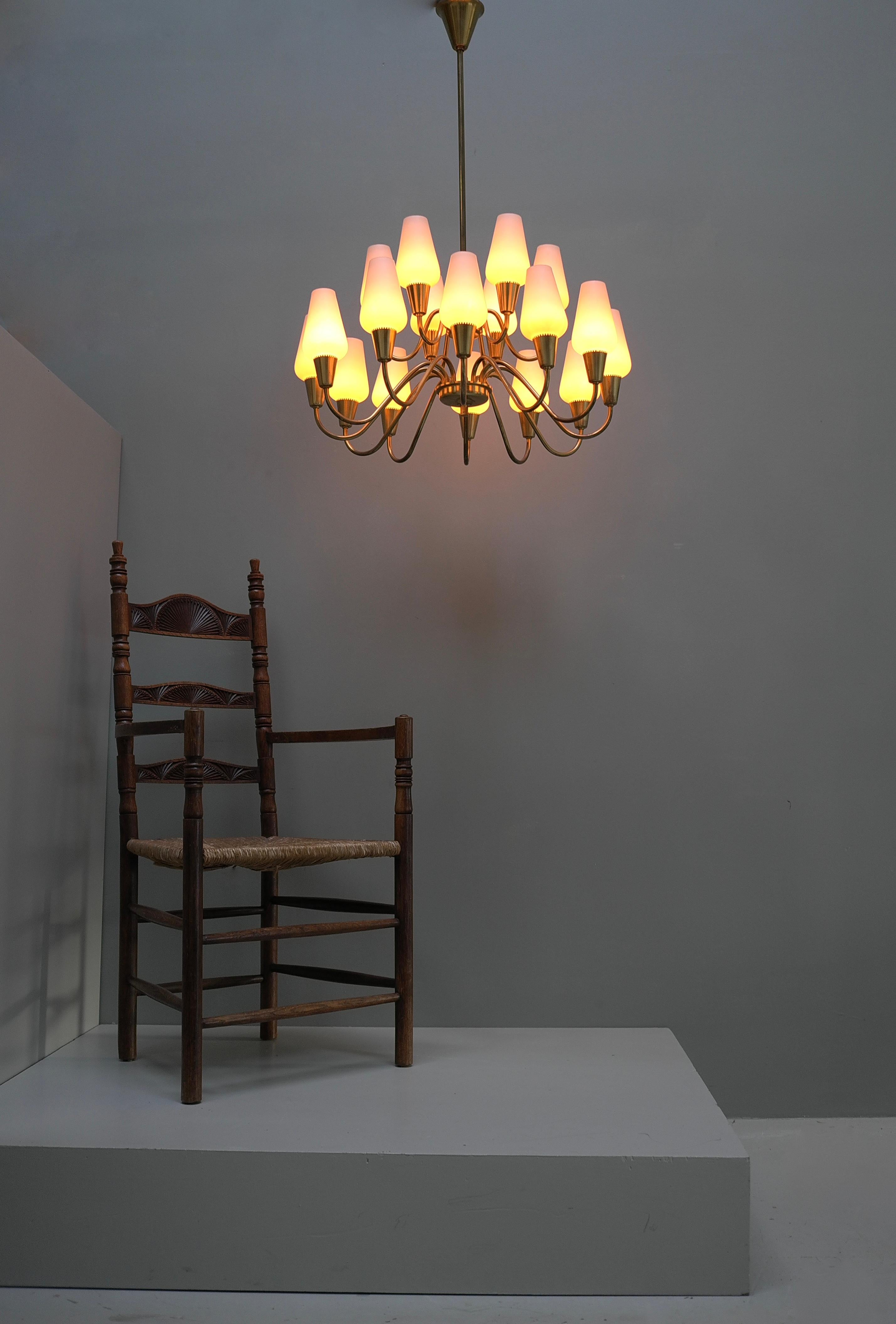 Brass and Opaline Glass Chandelier by Bent Karlby for Lyfa, Denmark 1960s

Well made quality piece that gives a very warm light depending what kind of bulbs you use.