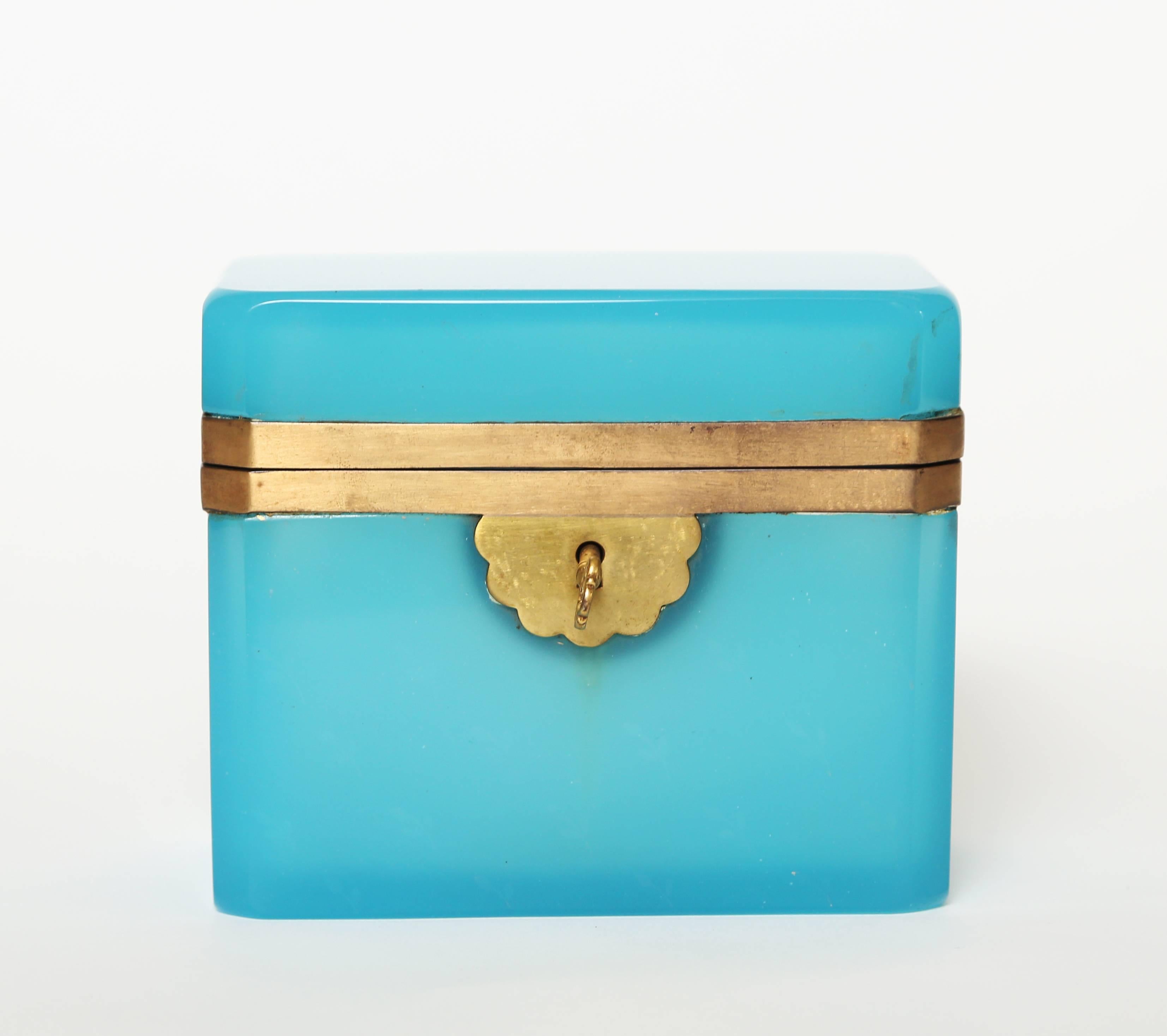 French turquoise glass hinged box with gilt brass frame and original gilt key. This box or coffer has remained in pristine condition.