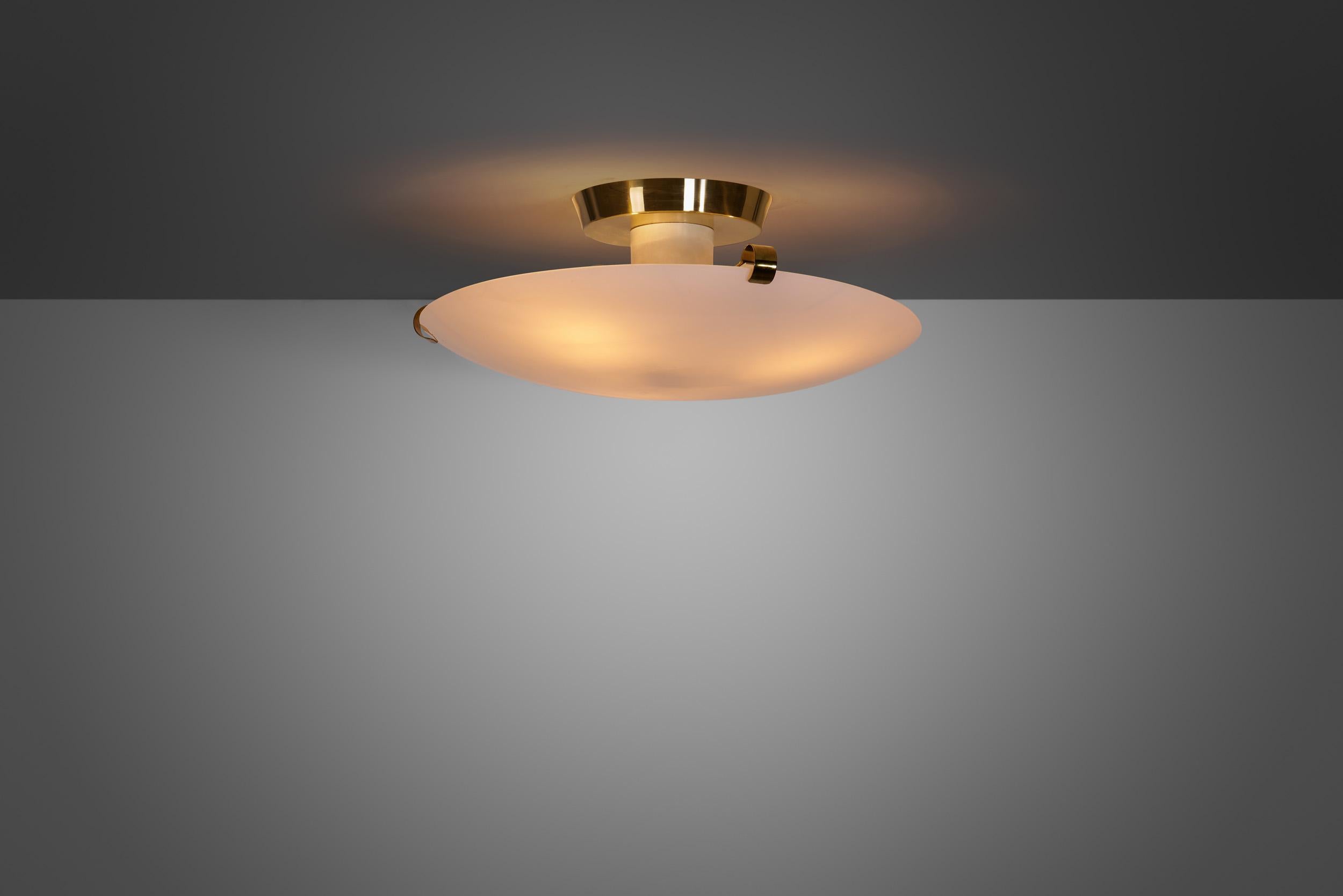 Finnish mid-century lighting design is world-famous for numerous reasons. The country’s designers managed to make strictly functional design look beautiful in addition to their practicality and high-quality. This Valinte Oy ceiling or plafond lamp