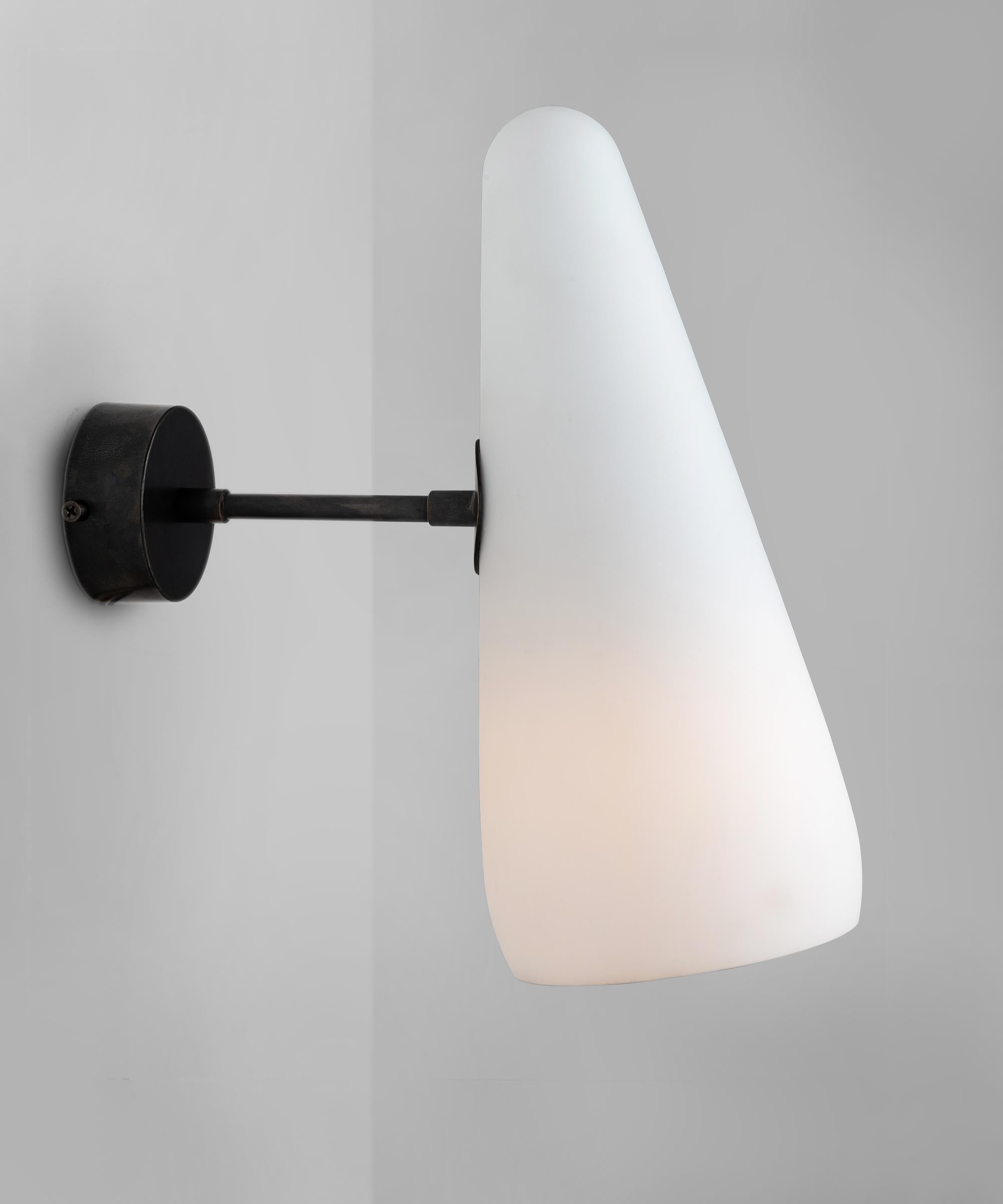 *Please note the price is per unit, and the lights are sold individually*

Opaline glass cone sconce

Made in Italy

Opaline glass shade with fixed brass arm and backplate.

Measures: 5