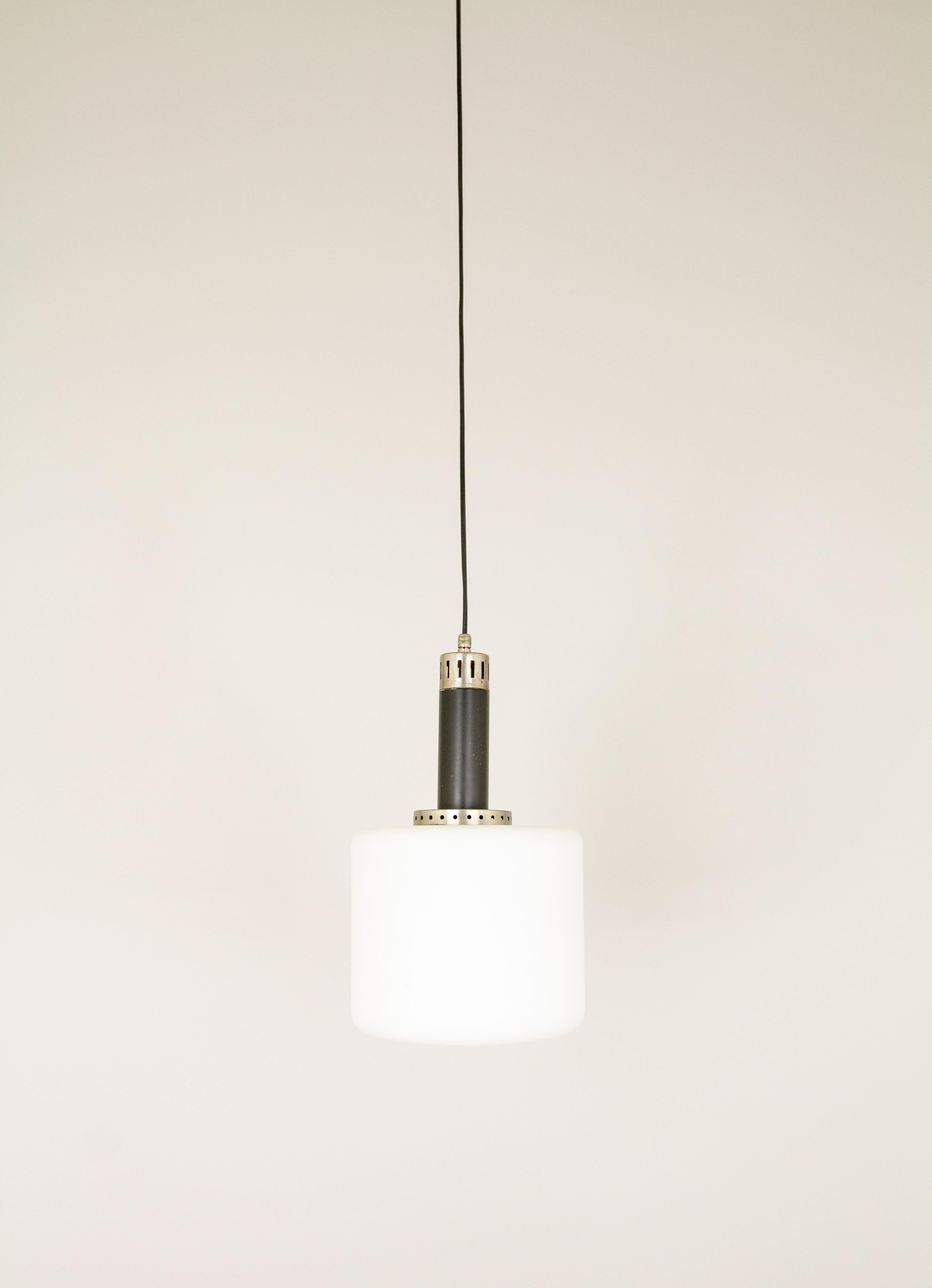 Clean opaline glass pendant designed by Stilnovo from the 1950s. 

It is composed of a cylindrical lampshade with a metal stem and detailing.

The lamp is in good vintage condition, with some small marks on the black part of the stem.