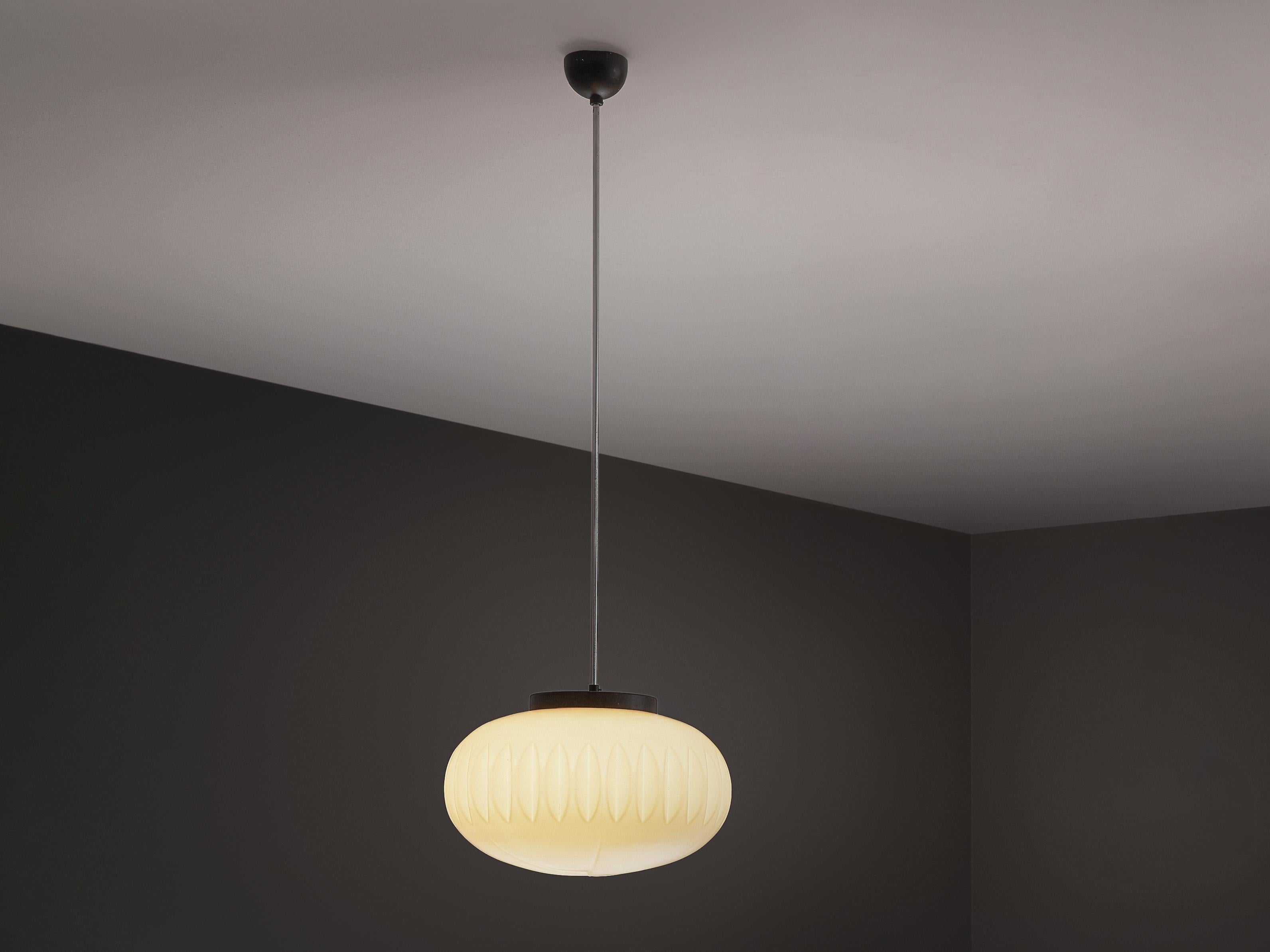 Pendant, opaline glass, metal, Europe, 1970s. 

This elegant 1970s pendant features a structured opaline glass shade with ridged sides and a graphic pattern on the bottom, creating a captivating light effect. The warm, diffused glow beautifully
