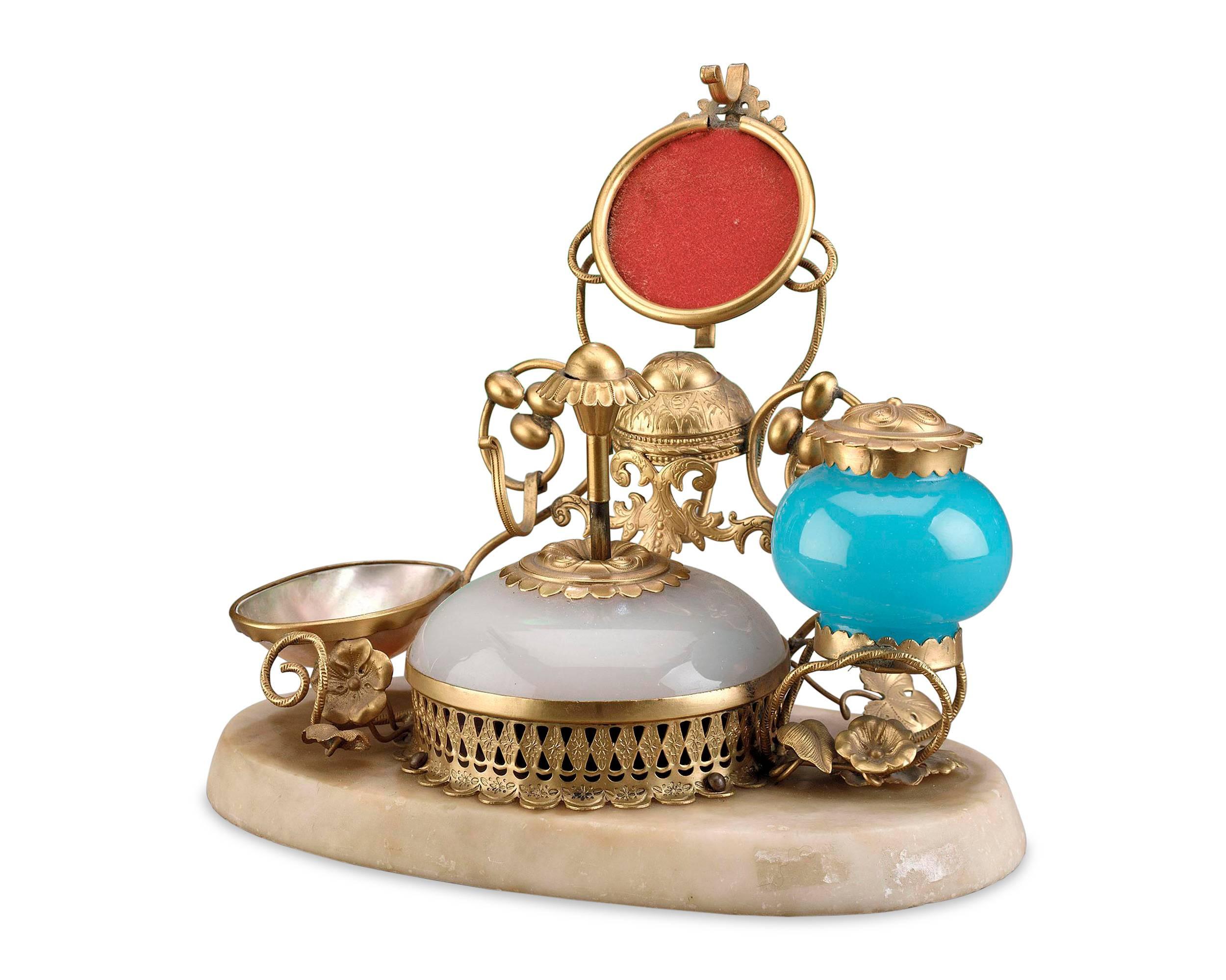 This superb opaline glass perfume set is wonderfully equipped with a bell push and inkwell set in doré bronze and mounted on a marble base. Excellent condition, circa 1860.