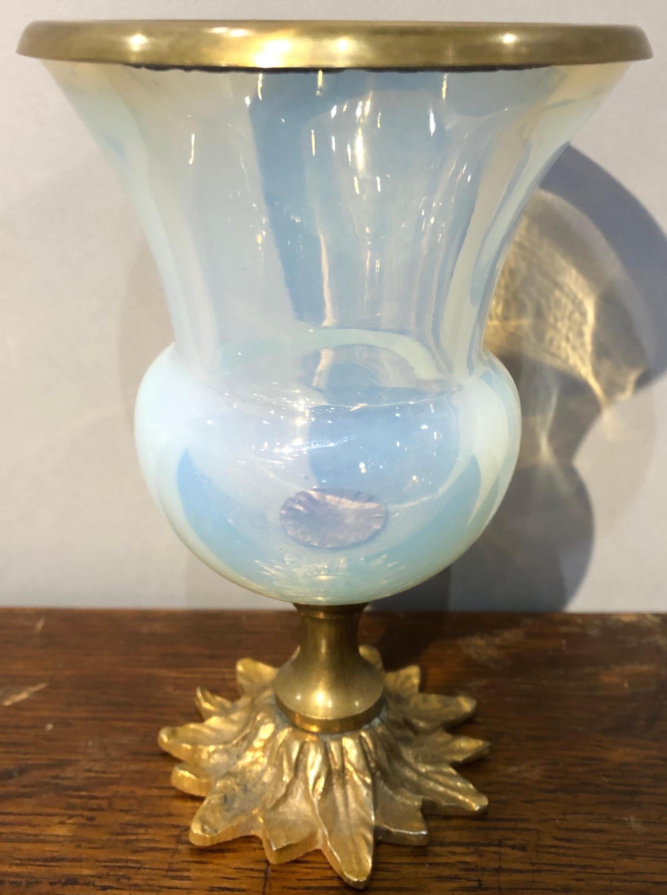 Opaline glass urn with bronze rim and base.