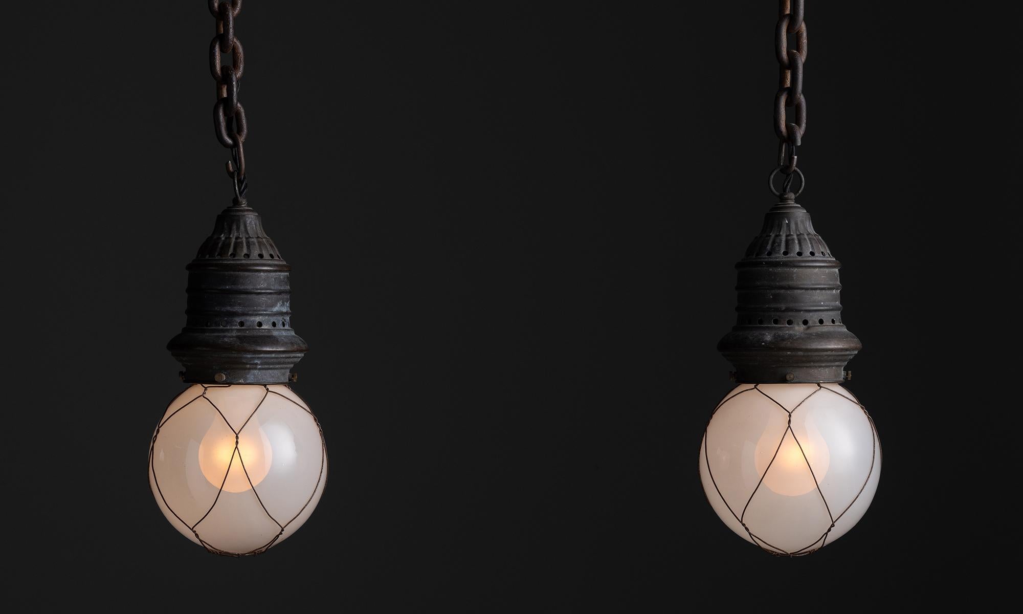 *Please note the price is per unit*

Opaline Globe Caged Pendants, Netherlands, circa 1930

Diminutive industrial pendant with opaline glass globes.

Measures 6”dia x 12”h

*Not UL Listed*