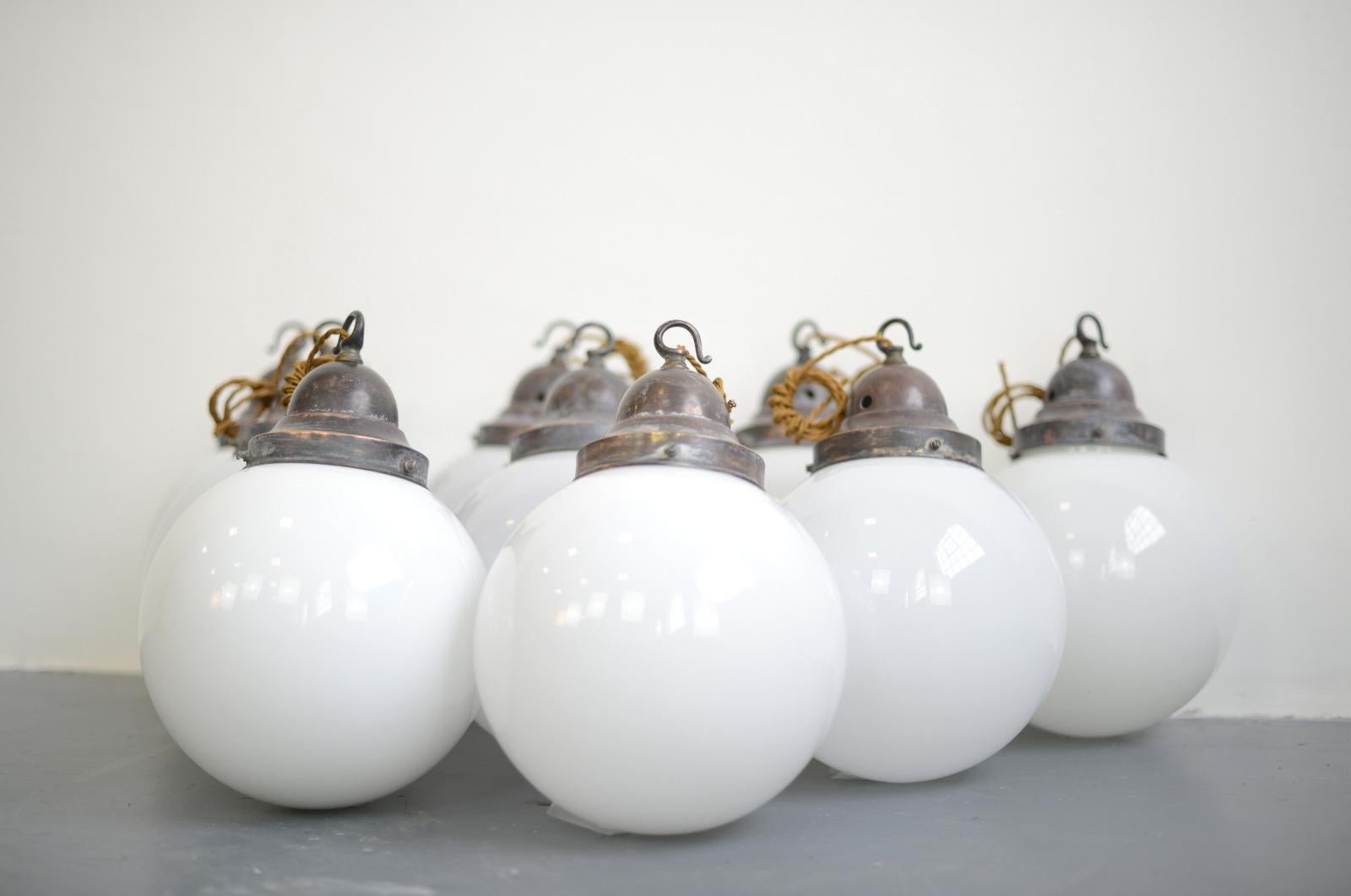 Opaline globe pendant lights, circa 1930s

- Price is per light
- White opaline glass
- Copper galleries
- Takes e27 fitting bulbs
- Comes with 100cm of gold braided cable
- 2 globes have slightly thicker glass
- German ~ 1930s
- 21cm wide