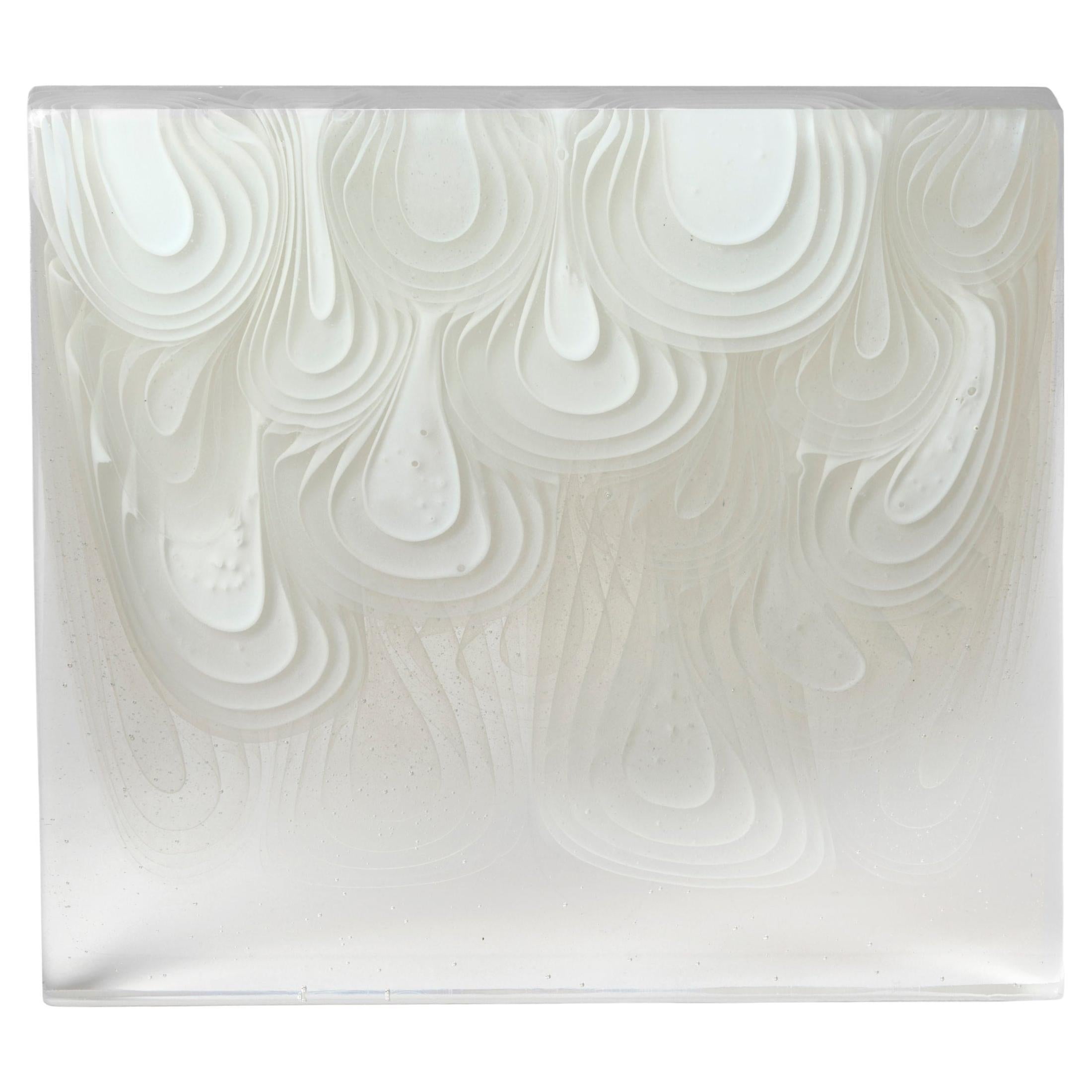 Opaline Infusion, a white 
clear fluid cast glass sculpture by Helen Restorick