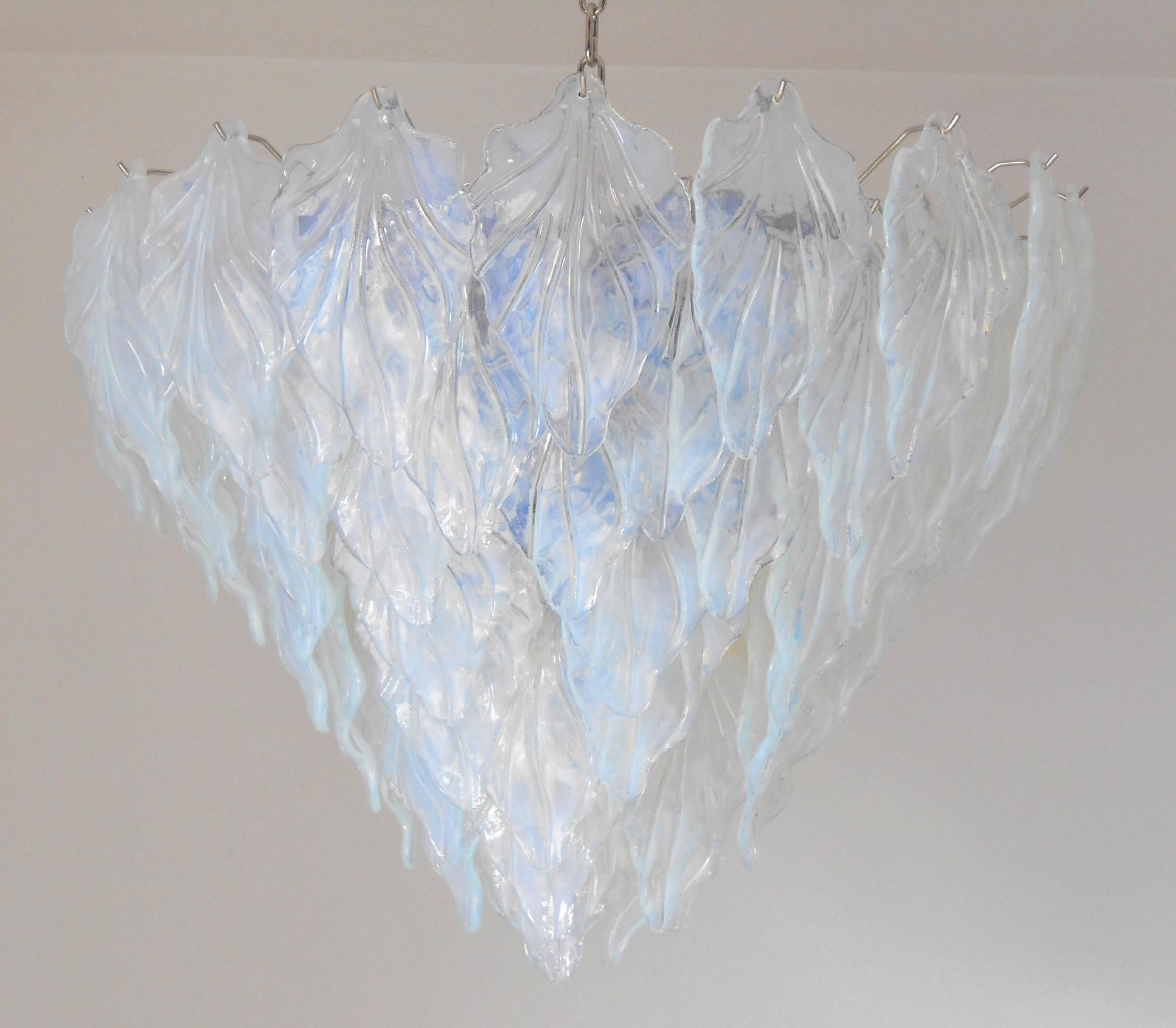 Italian chandelier shown with iridescent opaline murano glass leaves mounted on chrome finish frame / Designed by Fabio Bergomi for Fabio Ltd, inspired by Mazzega / Made in Italy
13 lights / E26 or E27 type / max 60W each
Measures: Diameter 33.5