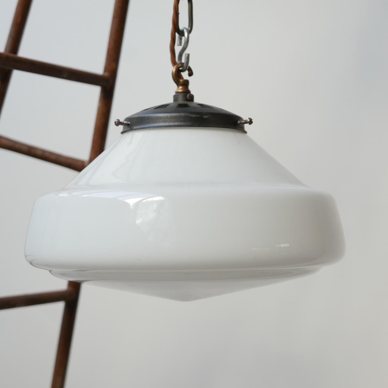 Midcentury pendant lights,

Holland, circa 1950s.

Opaline glass, brushed steel galleries.

Re-wired and PAT tested.

Four available. Three are perfect condition. One has a crack to rim of the glass which cannot be seen but must be