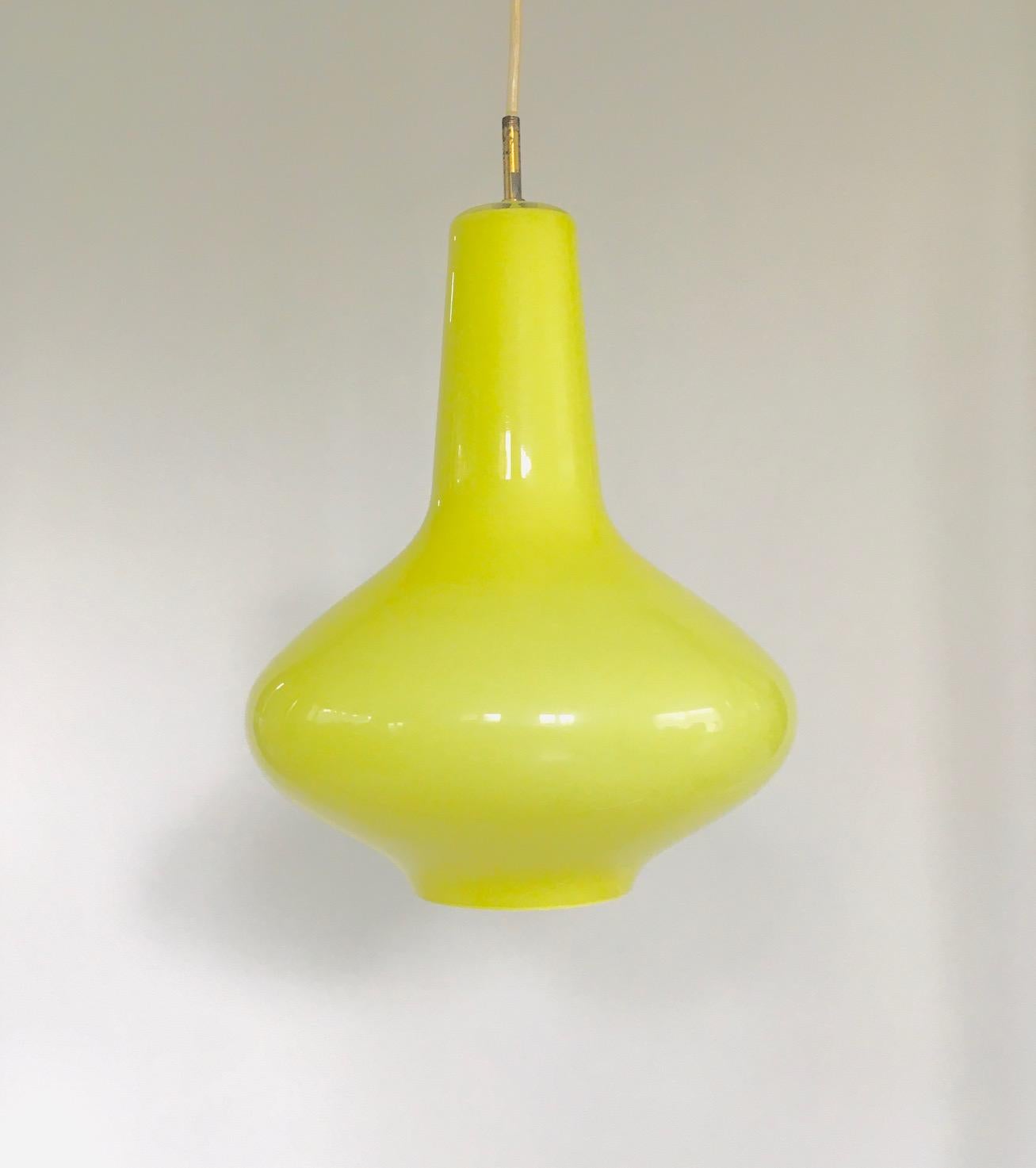 Vintage Midcentury Modern Design Yellow Opaline Glass Pendant lamp designed by Massimo Vignelli for Venini, Murano, Italy 1950's. Handblown opaline Venini glass. It has a lime yellow coloured glass with all the original parts. The wires have been