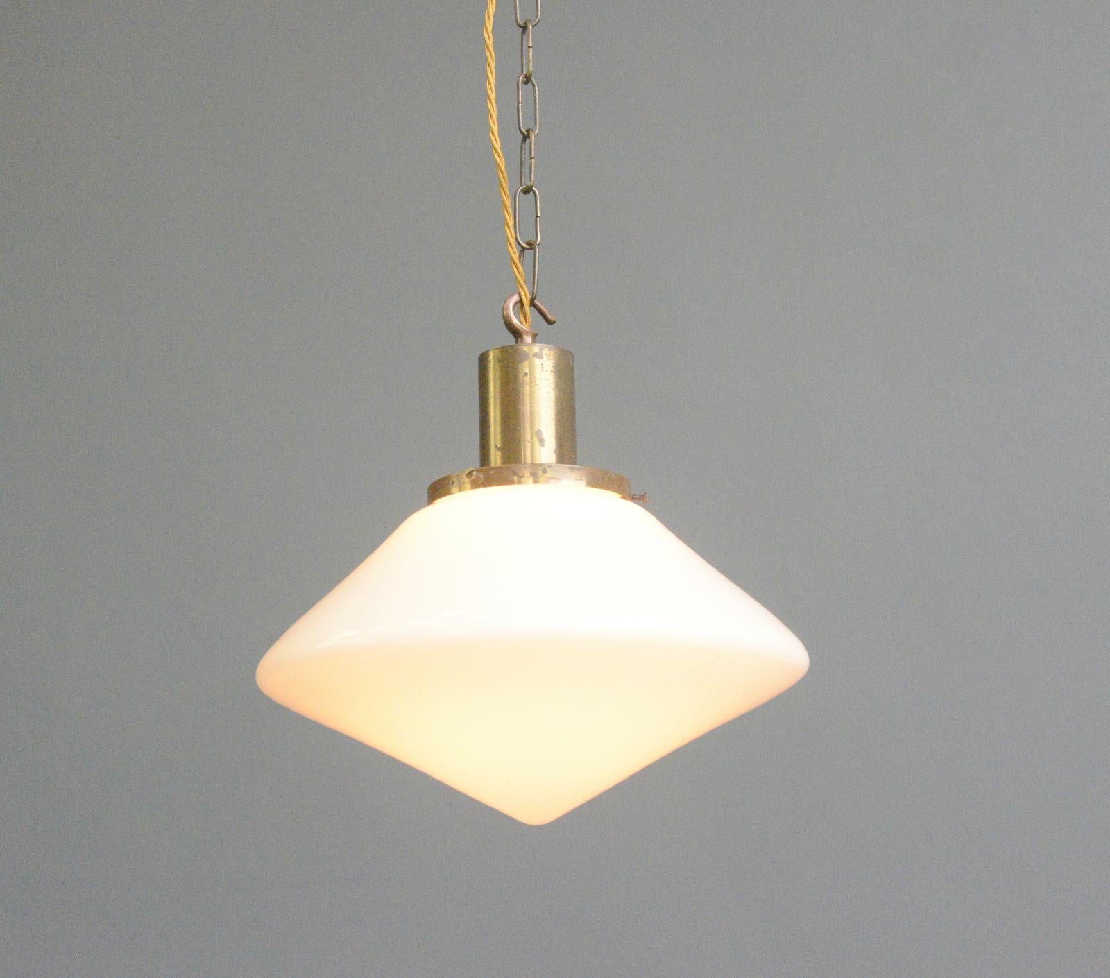 - Pointed opaline glass shade
- Brass gallery
- E27 fitting bulb holder
- German ~ 1930s
- 30cm wide x 35cm tall

Condition report

Fully re wired with modern electrical components, some patina to the brass gallery but no damage to the glass.