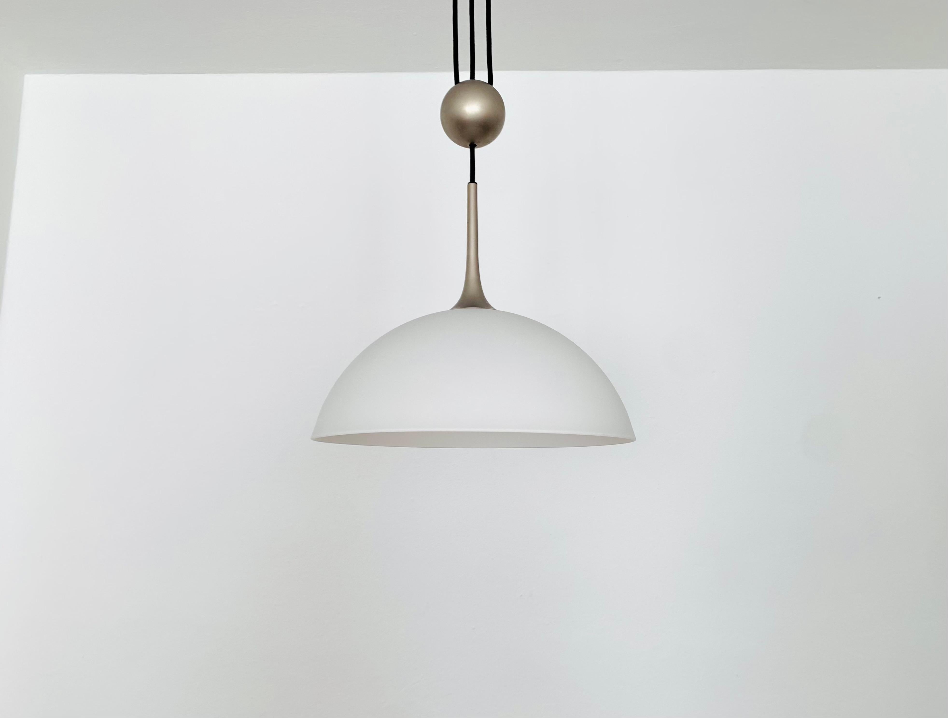 Very nice, height-adjustable pendant lamp from the 1970s.
The lighting effect of the lamp is extremely beautiful.
The design and the very beautiful details create a very noble and pleasant light.
The lamp creates a very cozy atmosphere and is of