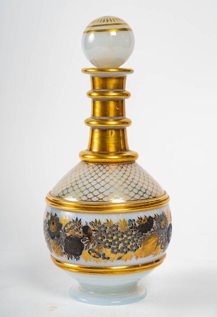 Opaline service in Charles X style, XIX century
Opaline service in the Charles X style, gold enamelled, 19th century, consisting of a carafe, a glass and a sugar bowl.
Carafe - h: 26 cm, d: 12 cm
Glass - h: 14 cm, d: 9 cm
Sugar bowl - h: 17 cm,