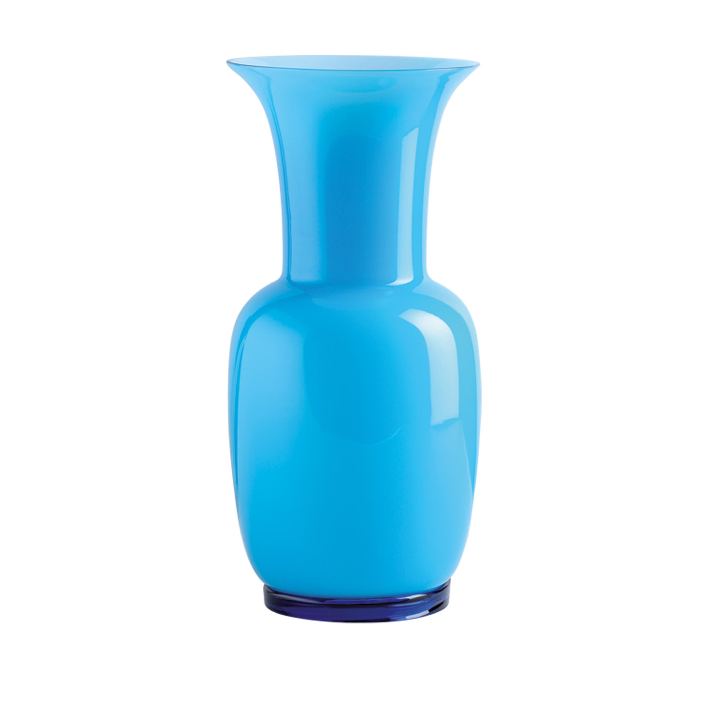 Venini glass vase with slim, oval shaped body and funnel shaped neck. Featured in aquamarine colored glass. Perfect for indoor home decor as container or strong statement piece for any room.

Dimensions: 17 cm diameter x 36 cm height.