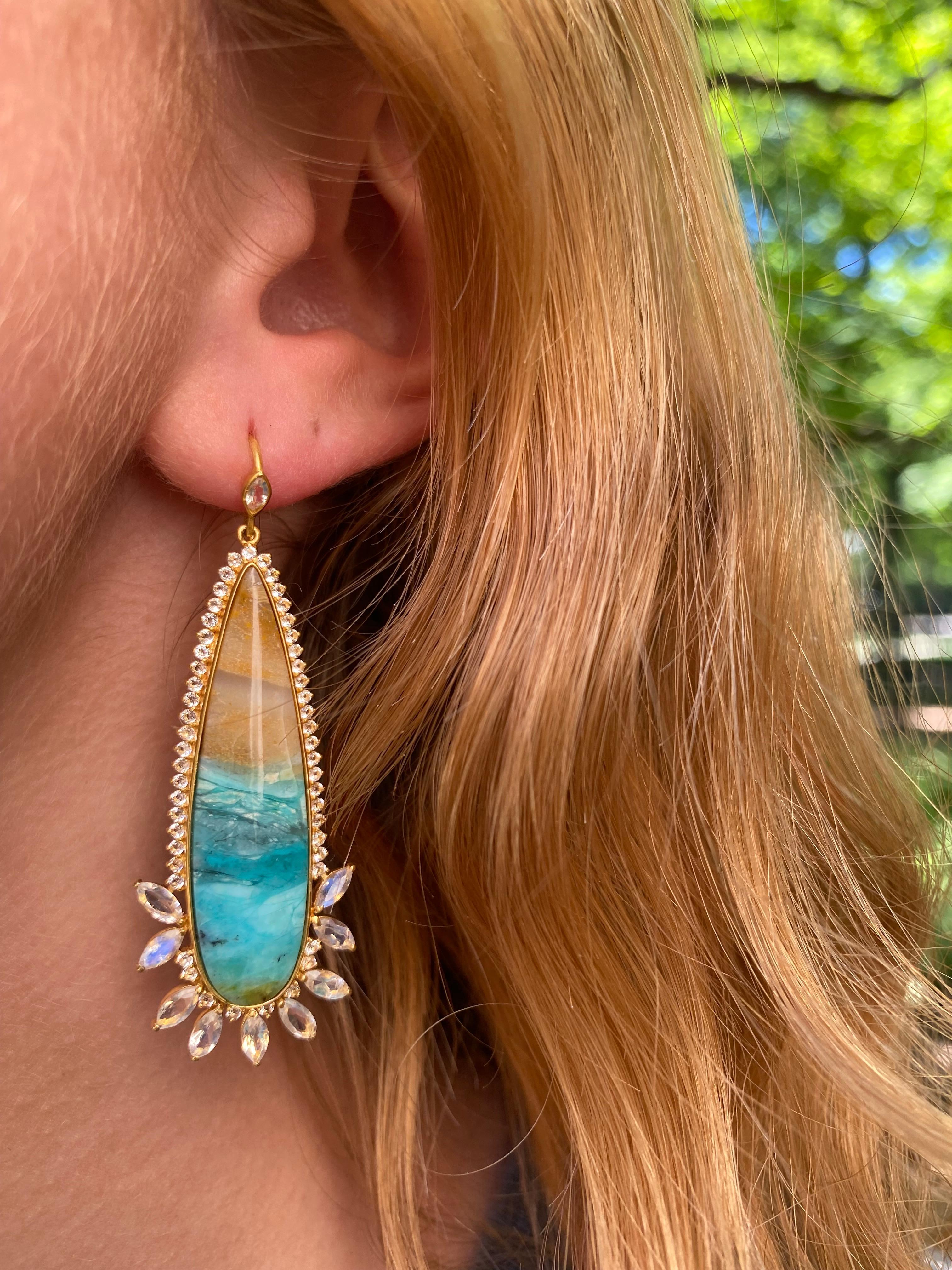 Designed by award winning jewelry designer Lauren Harper, these Rainbow Moonstone, White Sapphire and Petrified Opalized Wood earrings are simply stunning. Set in a warm 18kt matte Gold, these Petrified Wood center stones are like looking at a