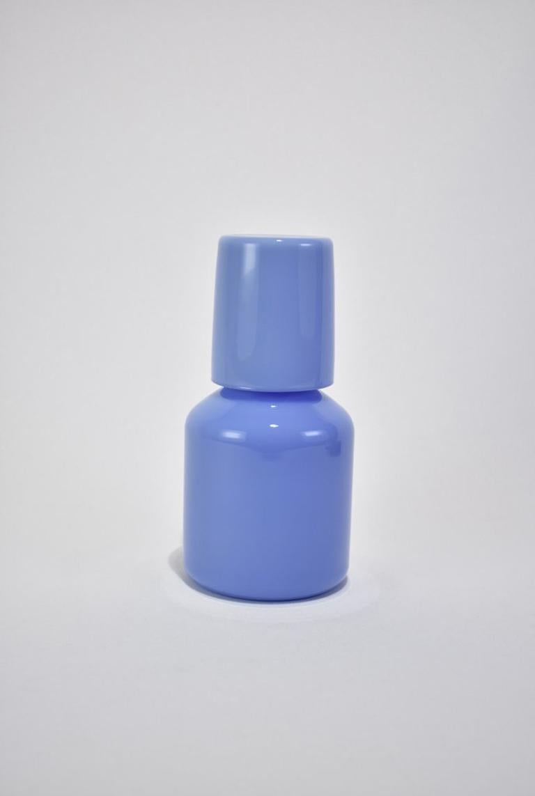 Opaque bleuet carafe set by Maison Balzac inspired by the traditional sets used in France and displayed on a bedside table at night.

Food grade colored glass, individually mouth blown.
Heat and cold resistant.
Hand wash