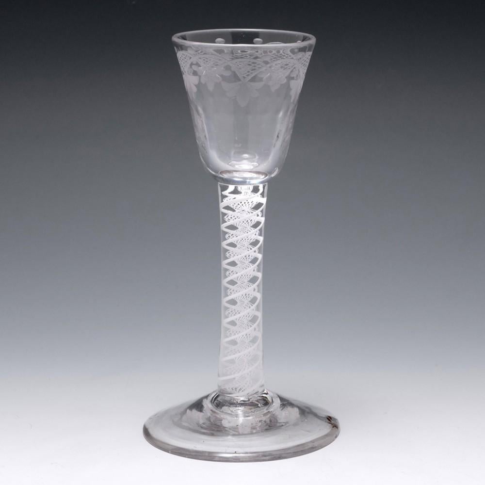 Opaque Twist Georgian Cordial Glass, c1760

Additional information: 
Period : George II - George III 
Origin : England 
Colour : Clear 
Bowl : Round funnel with cross hatched swags, pendant leaves and berries; rib moulded to the lower half of the