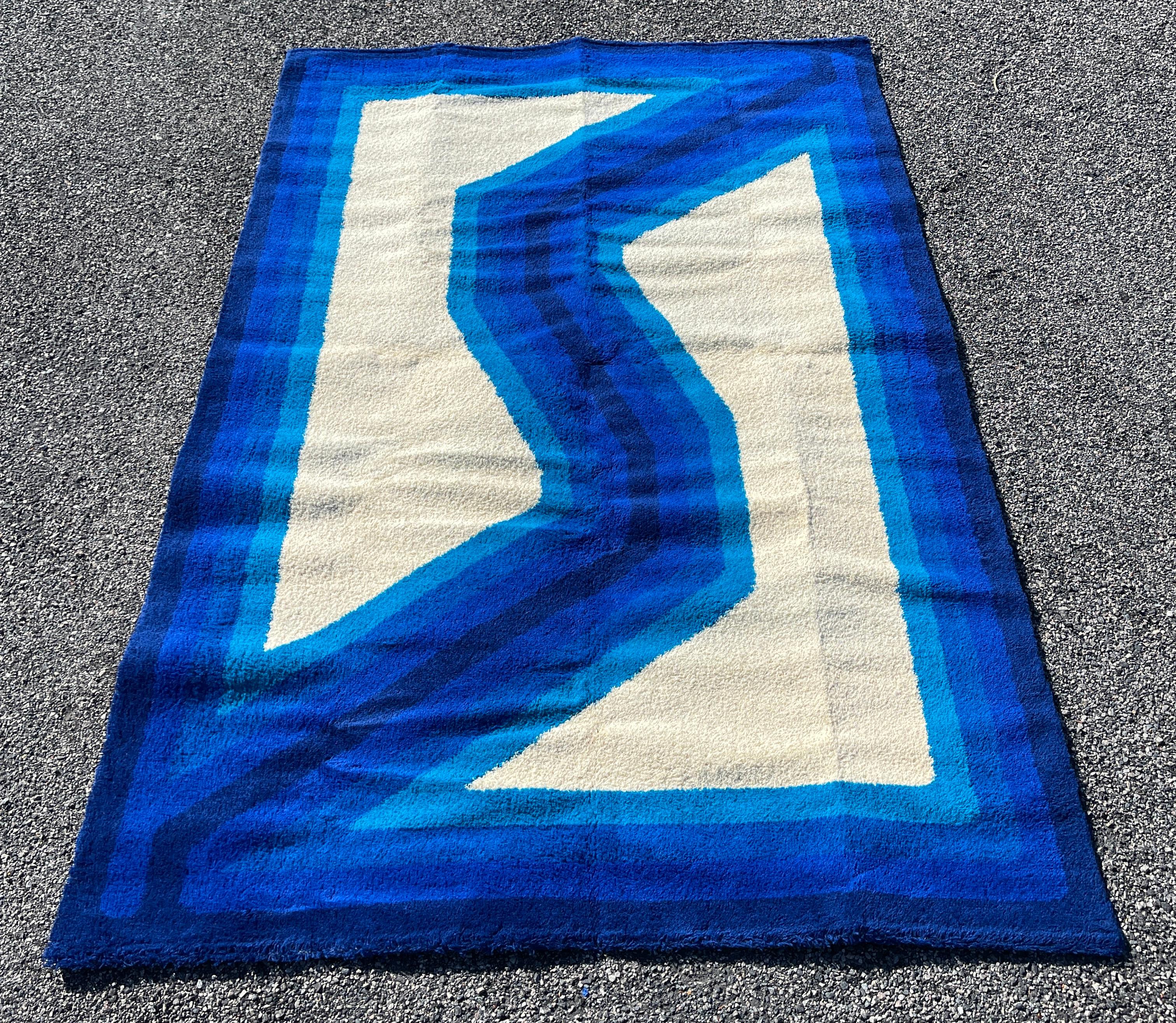 Vintage rectangular Danish rya rug, tones of blue on off-white, 100% wool, produced in the 1960's but never used. Has been kept rolled and wrapped in storage for over 50 years. Your feet will be the very first to walk on it. Produced in Denmark by