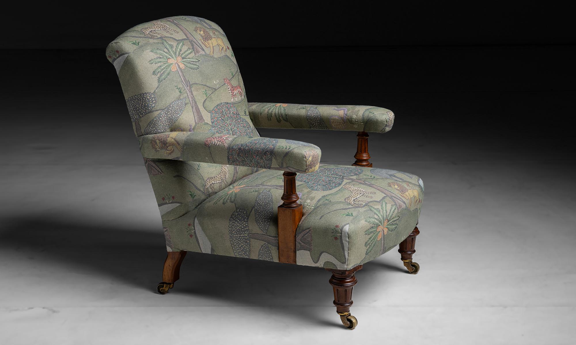 Open Arm Library Chair in linen fabric by James Malone

England circa 1910

Newly upholstered in James Malone 100% linen on antique frame with fluted legs and arm supports.

Measures 26.75”w x 34”d x 33”h x 14”seat