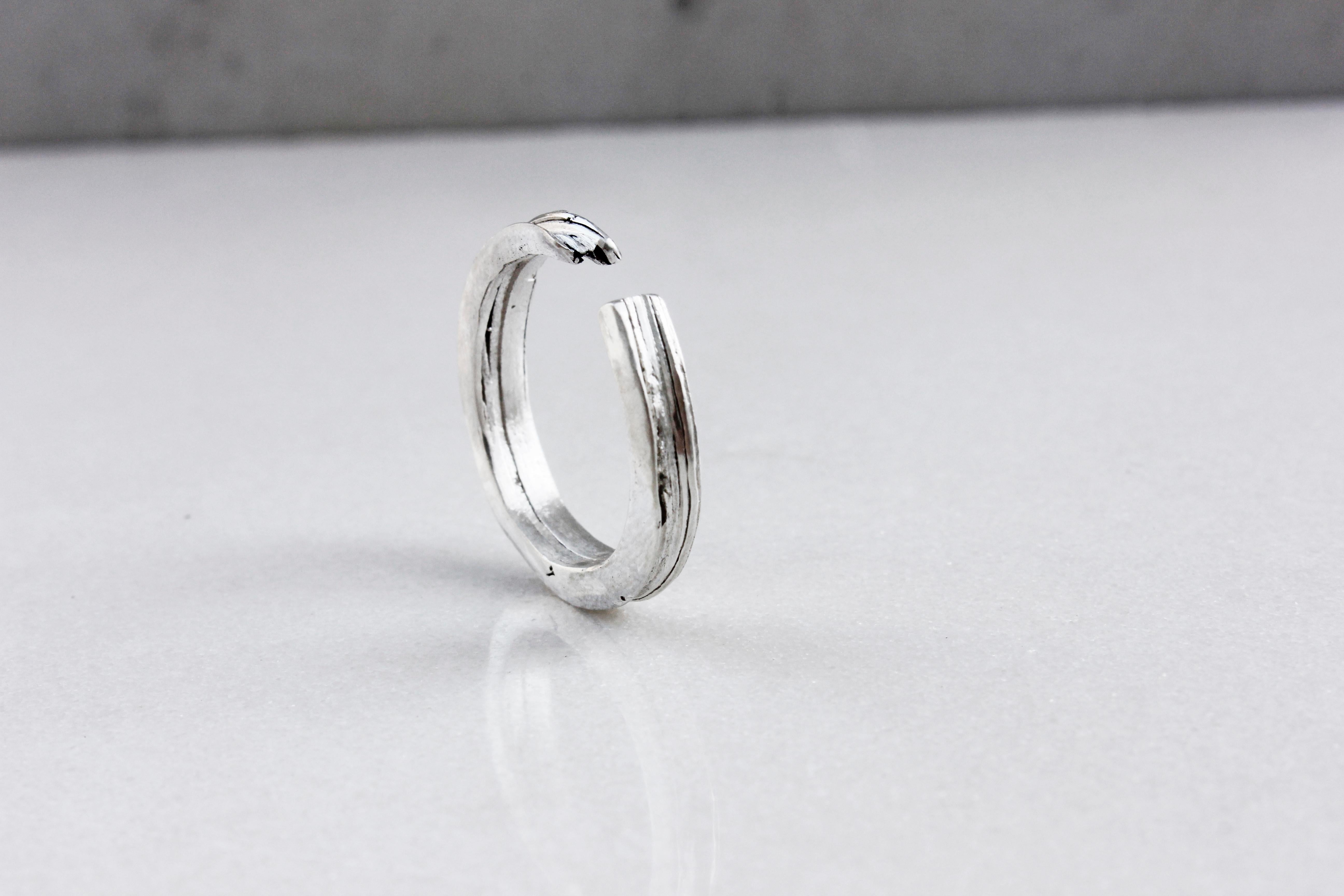 Made from eco silver sheets soldered together to create this unique texture of layers.

This adjustable open band ring is ideal if you are unsure of your size.
