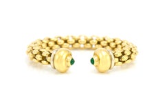Bracelet jonc ouvert avec deux émeraudes cabochons