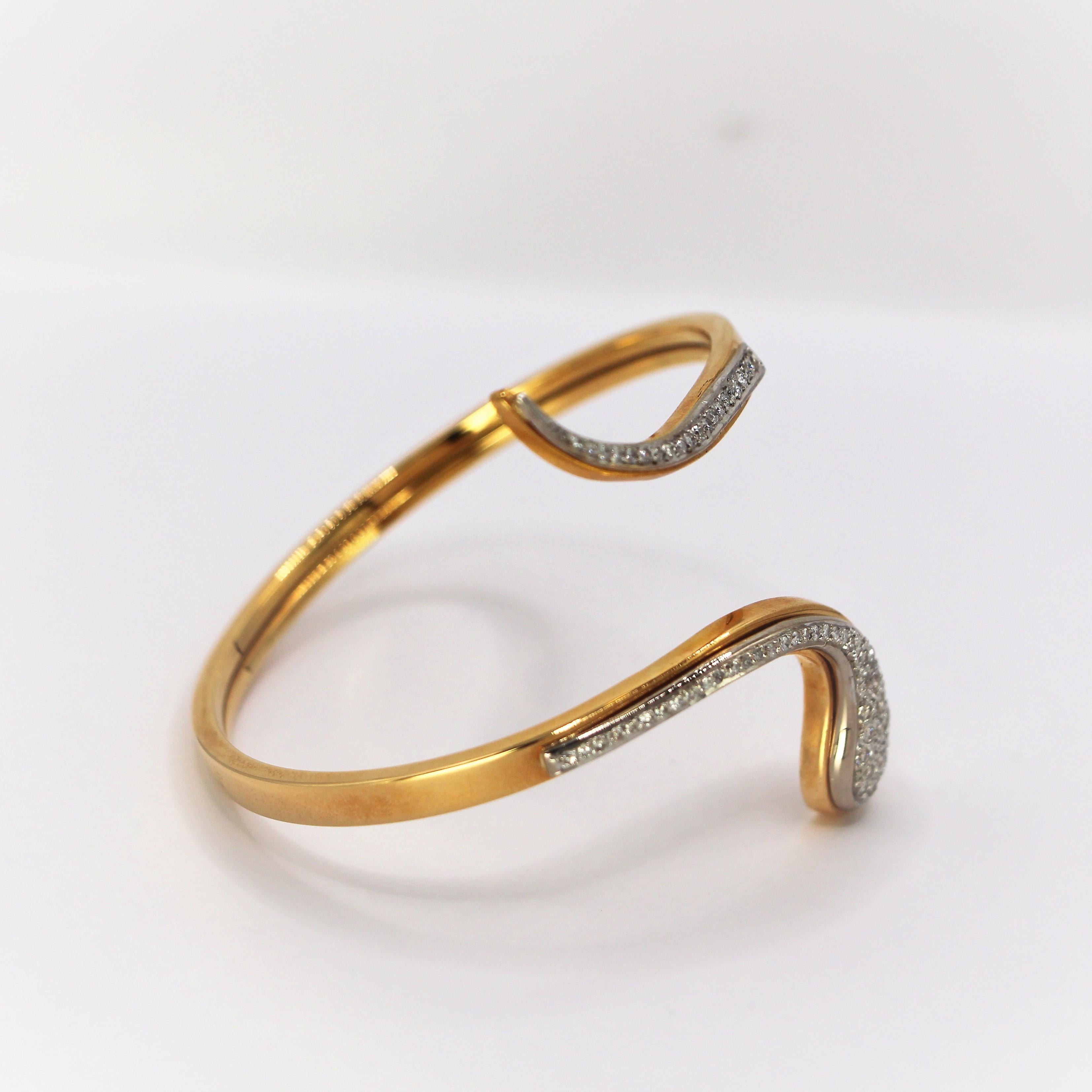 Open Bangle Snake Bracelet in 18Kt Yellow and White Gold  Diamonds Pave Setting, An open style bangle with the sneak and the diamonds in pave setting surrounded by white gold they give a reflection of glam around your hand, in a very stylish