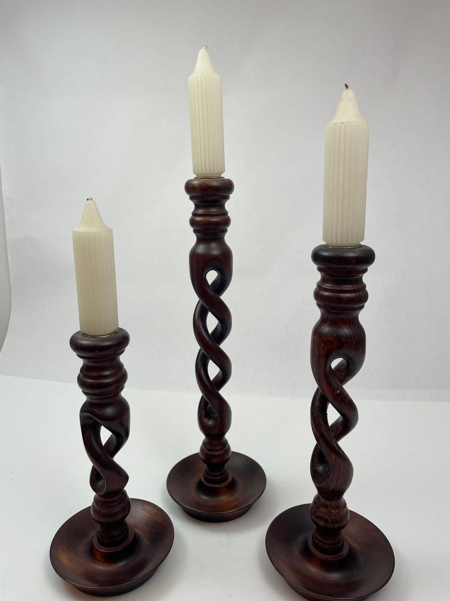 Open Barley Twist Wooden English Candlesticks set of 3.
Elegant Victorian pair of barley twist wooden candlesticks on round base.
Set of 3 in different height English oak open barley twist wooden candlesticks topped with brass candleholders.
A rare
