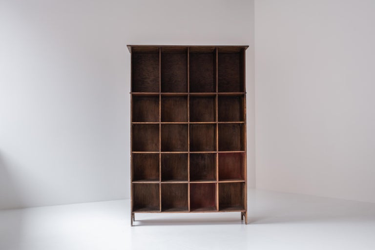 Open bookcase from France, designed and manufactured in the 1950s. This piece features several open storage area and remains in its untouched original condition.

Measurements
H 158 x W 107.5 x D 32.5 cm.