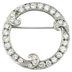 Open Circle Brooch with Round Diamonds and Swirl Detail in 14 Karat White Gold